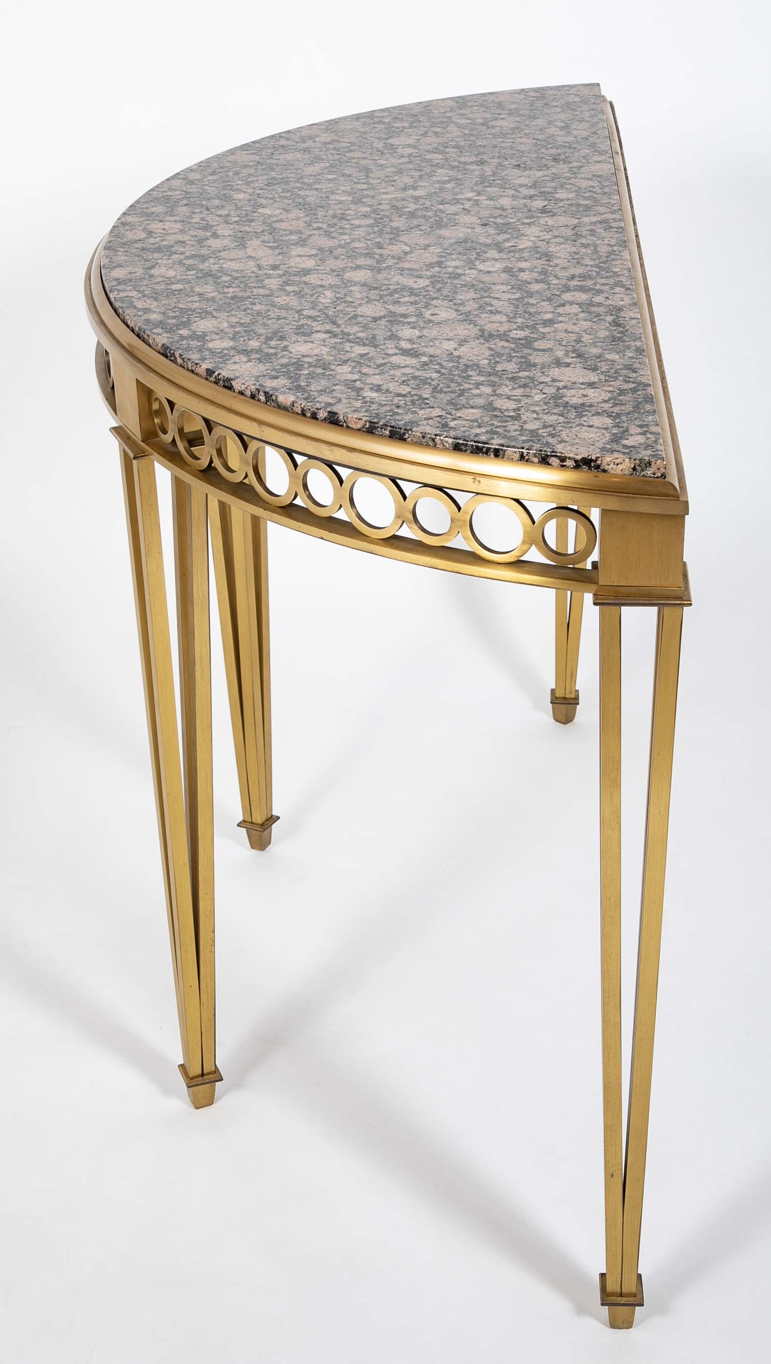 Striking Pair of Bronze Consoles with Fossilized Marble Tops