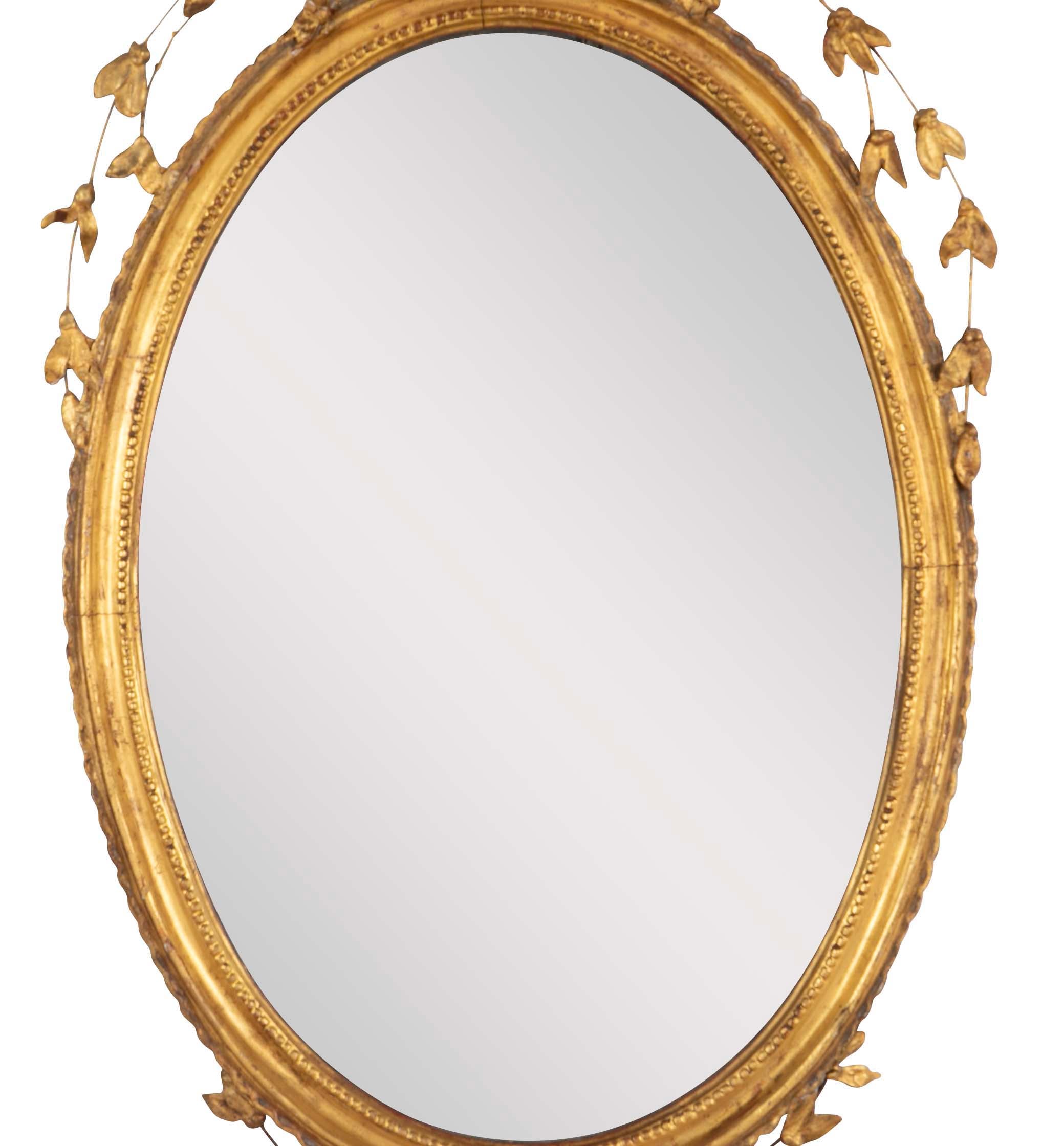 English George III Oval Hepplewhite Gilded Mirror with Ram's Head Surmount