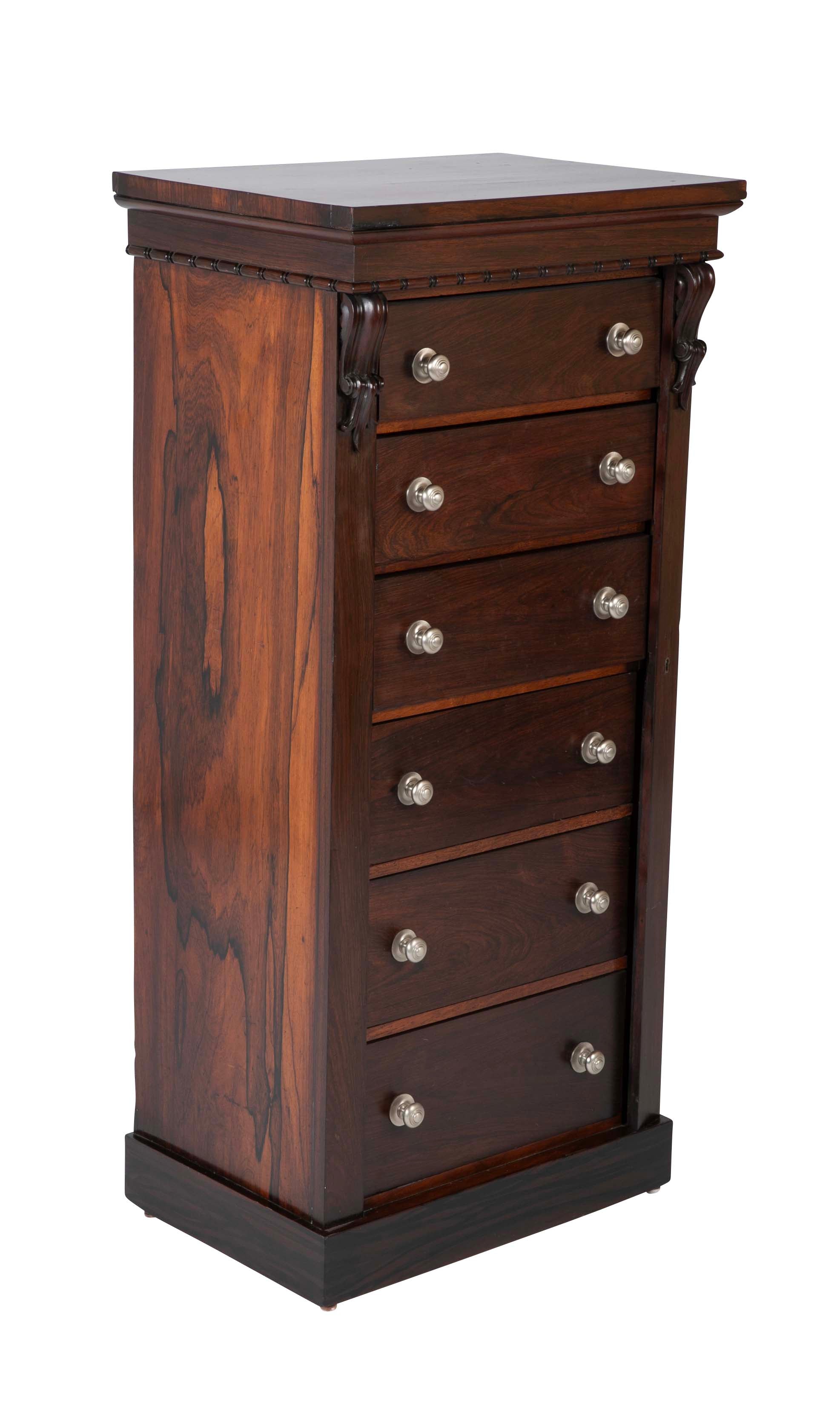 A 19th Century Brazilian Rosewood Six Drawer Wellington High Cabinet