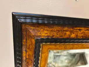 Dutch Baroque Style Ebonized Gilt Ripple Mold Framed Mirror with Beveled Glass