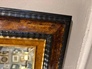 Dutch Baroque Style Ebonized Gilt Ripple Mold Framed Mirror with Beveled Glass