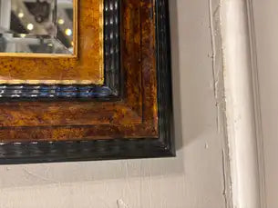 Dutch Baroque Style Ebonized Gilt Ripple Mold Framed Mirror with Beveled Glass