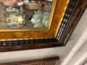 Dutch Baroque Style Ebonized Gilt Ripple Mold Framed Mirror with Beveled Glass