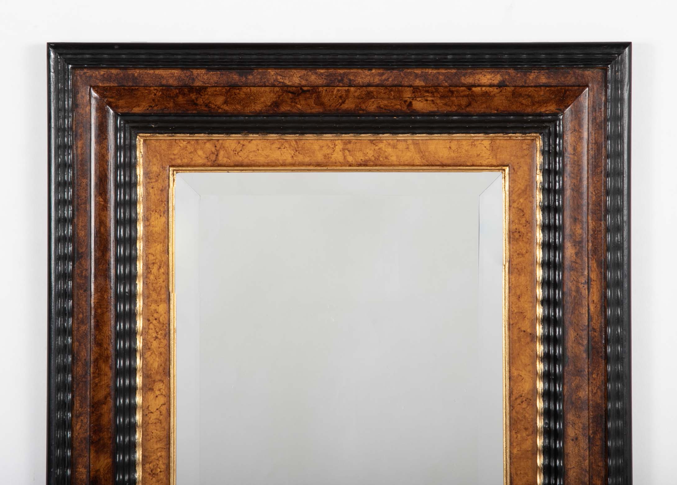 Dutch Baroque Style Ebonized Gilt Ripple Mold Framed Mirror with Beveled Glass