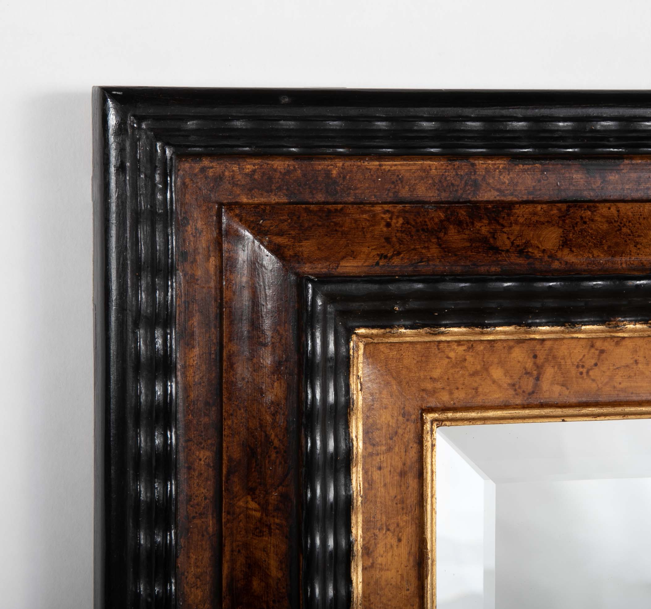 Dutch Baroque Style Ebonized Gilt Ripple Mold Framed Mirror with Beveled Glass