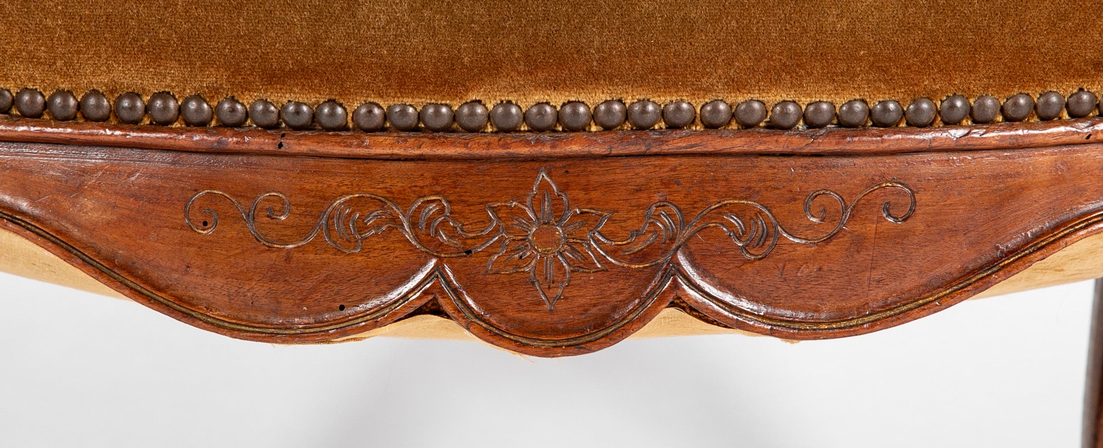 A Pair of French Carved Walnut Louis XIV Armchairs