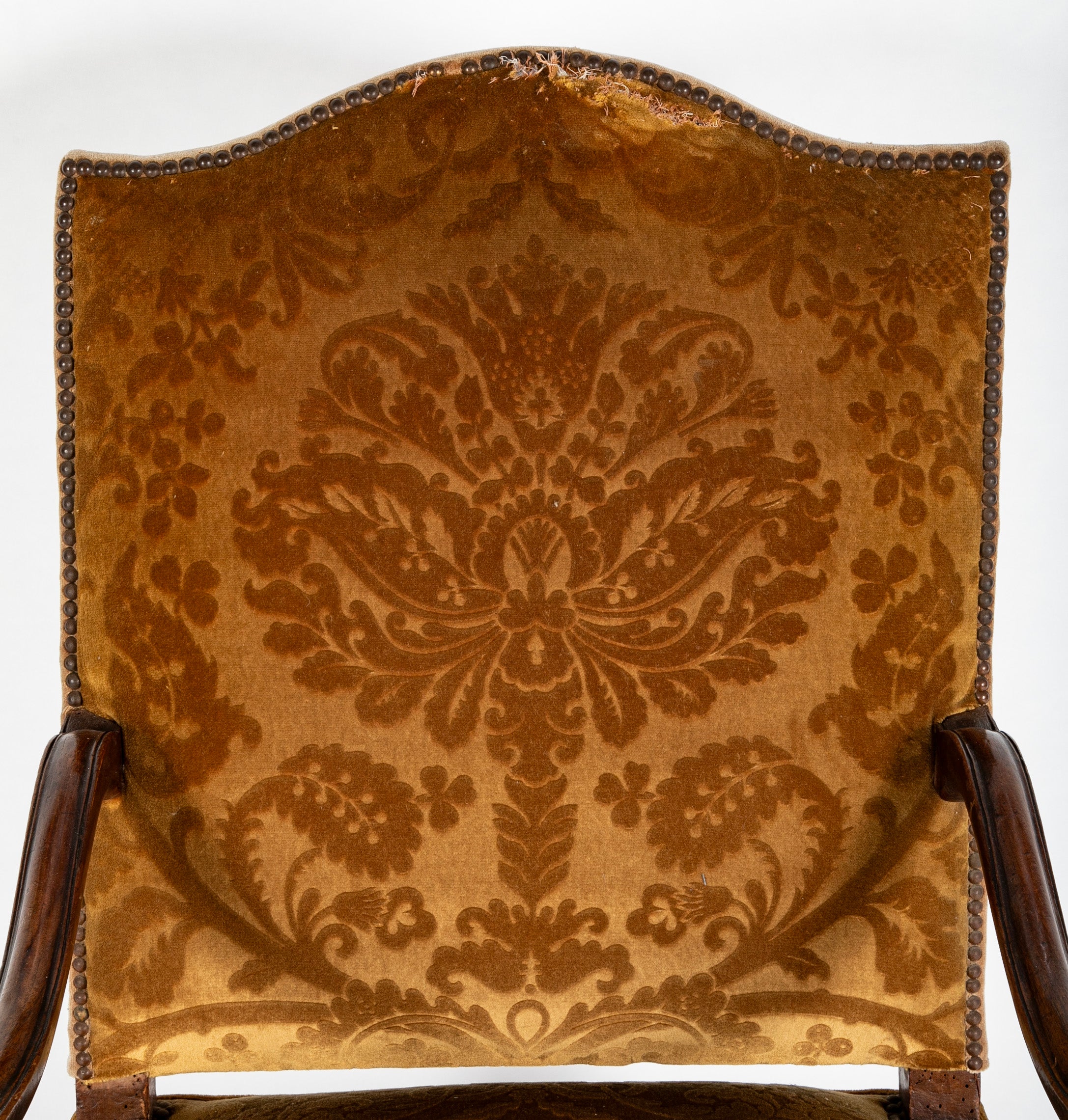A Pair of French Carved Walnut Louis XIV Armchairs