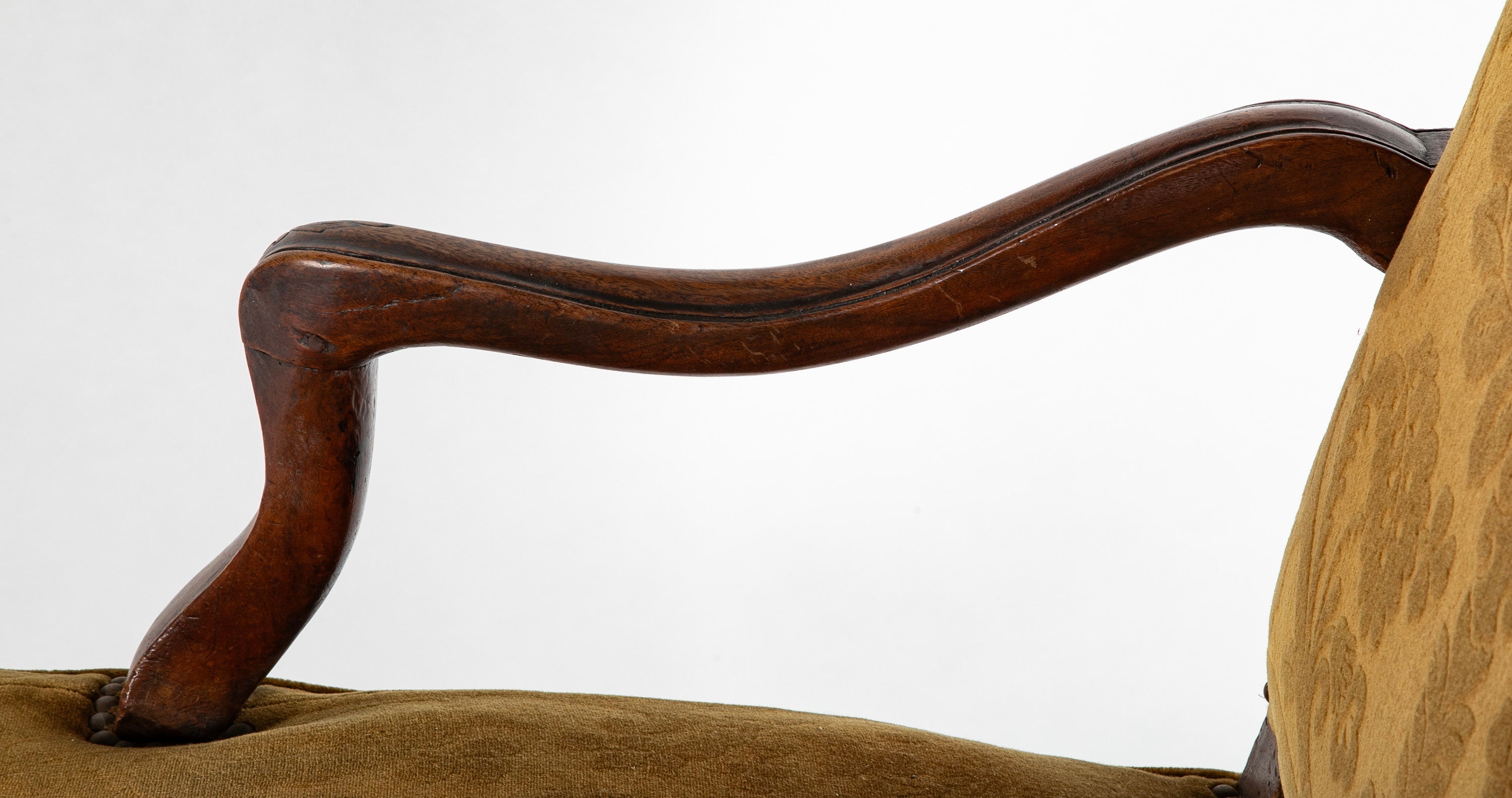 A Pair of French Carved Walnut Louis XIV Armchairs