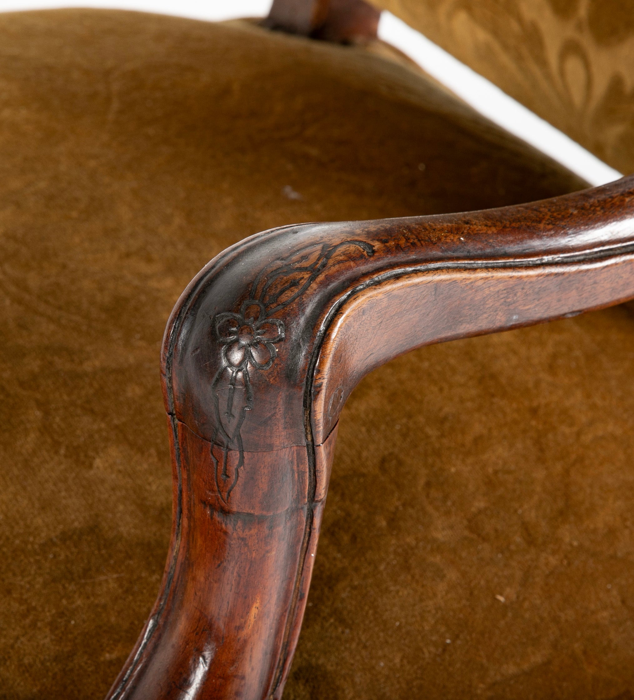 A Pair of French Carved Walnut Louis XIV Armchairs