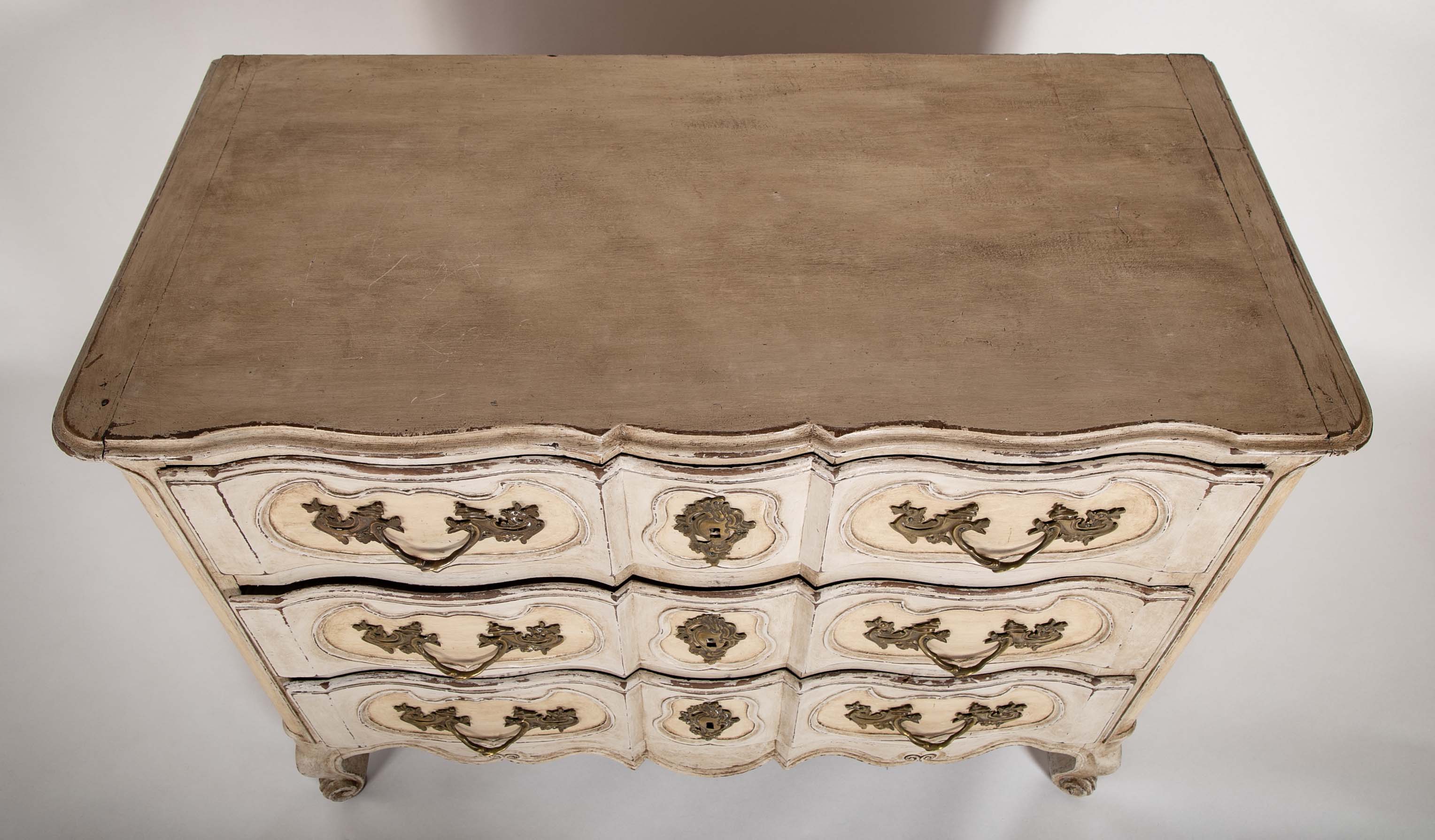 An 18th Century Robust French Provincial Serpentine Front Commode