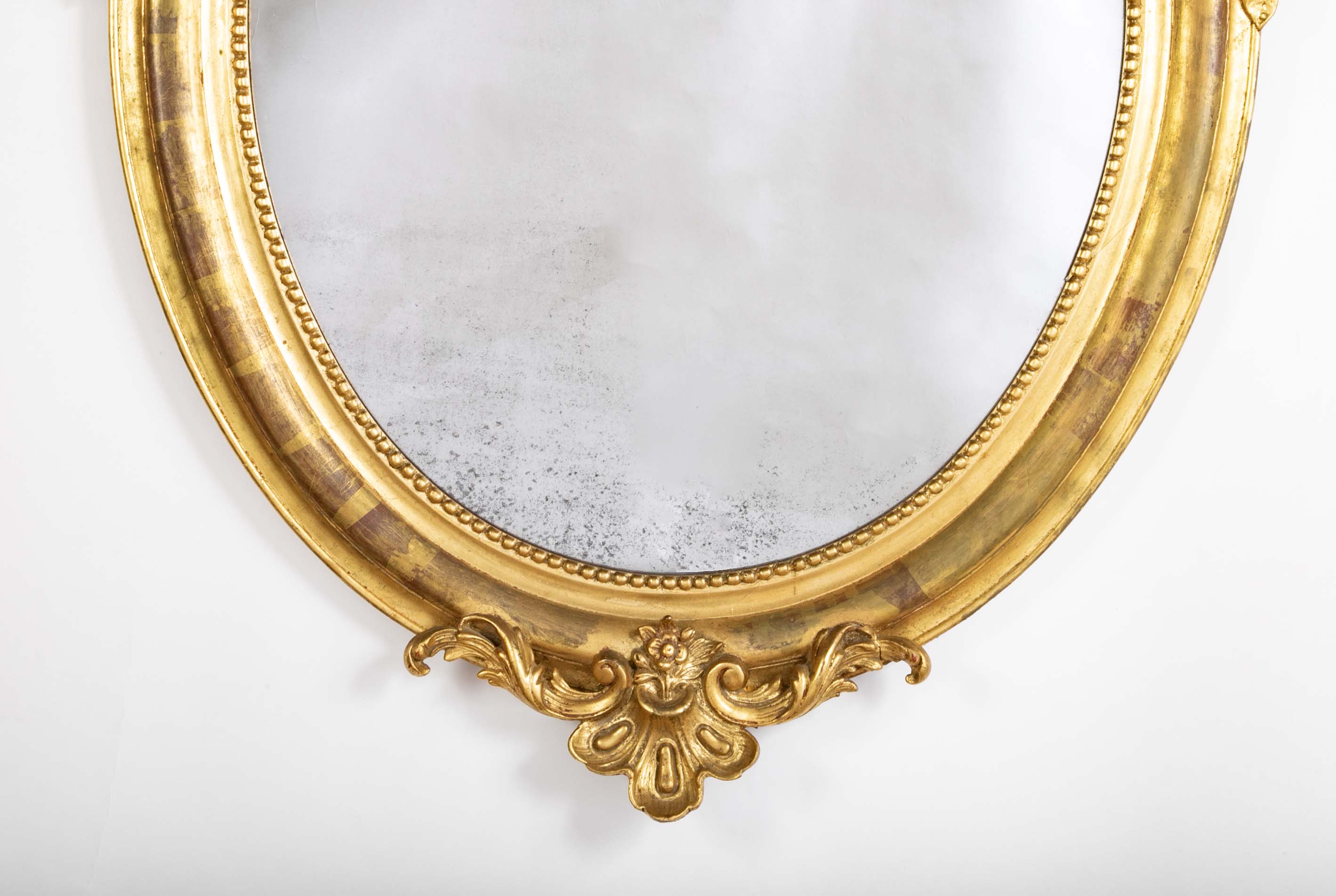 An 18th Century French Carved & Gilt Oval Mirror