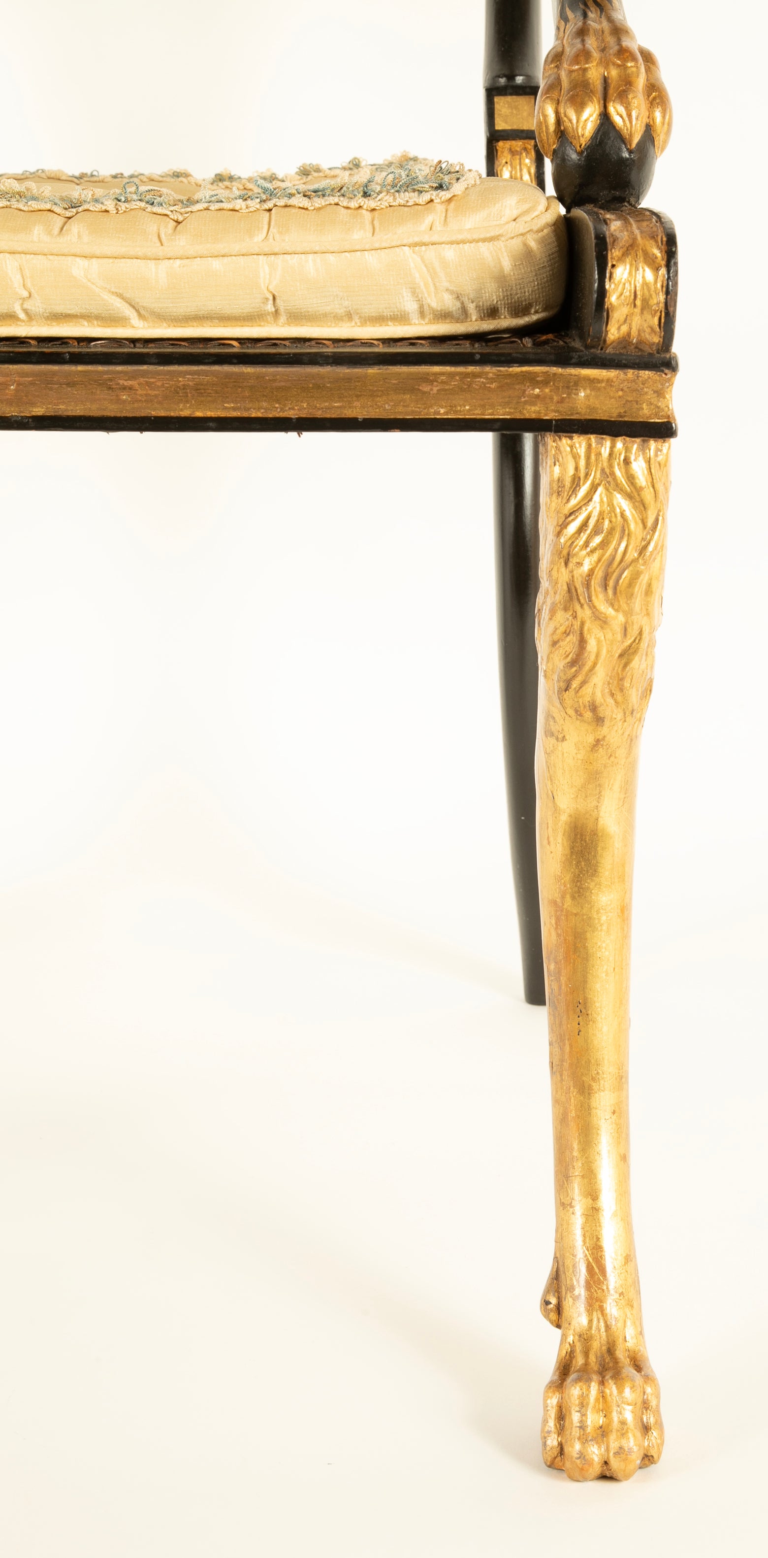 A Pair of Regency Style Ebonized and Parcel Gilt Armchairs