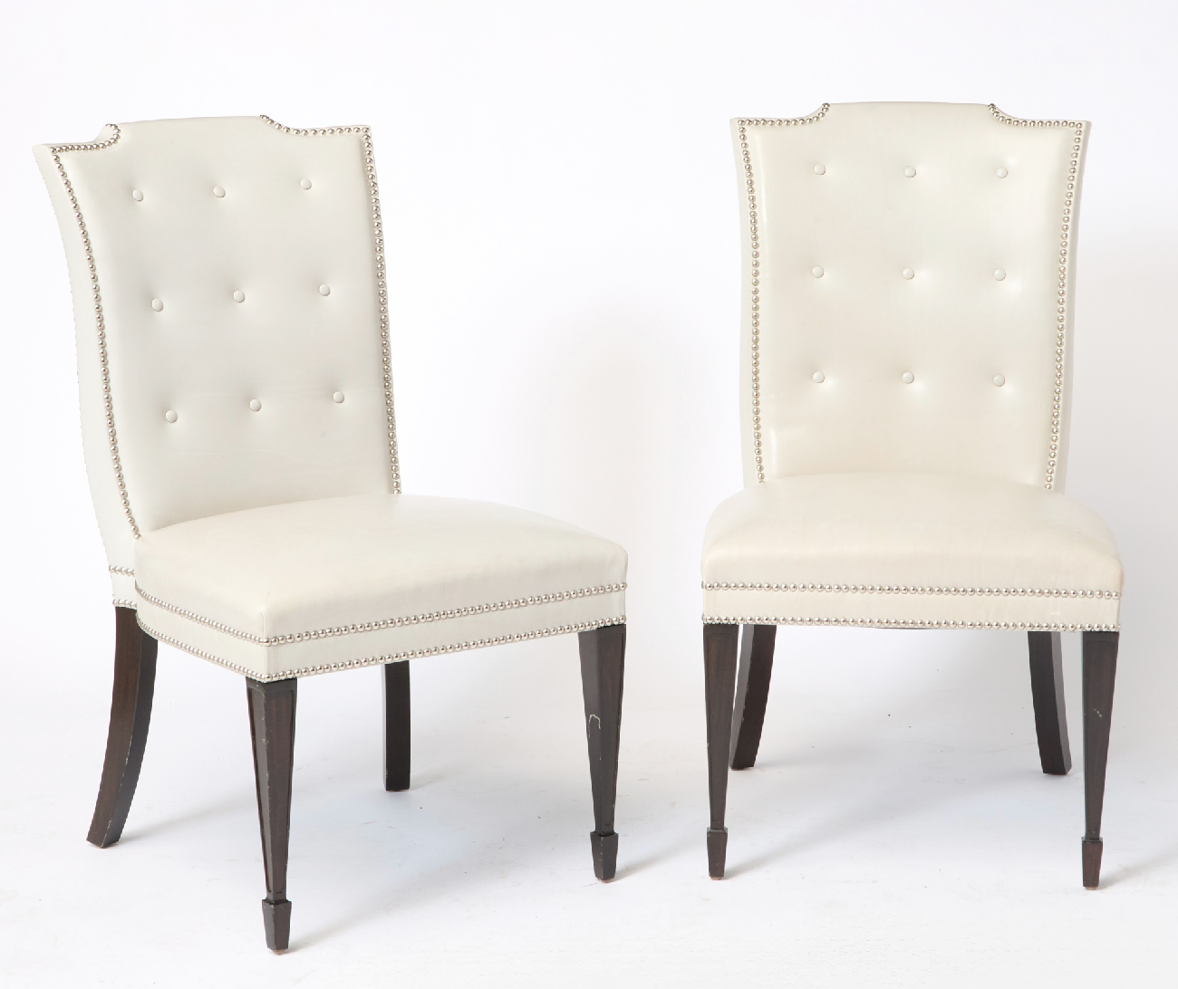 A Set of 12 Leather and Close Chrome Nailed Dining Chairs
