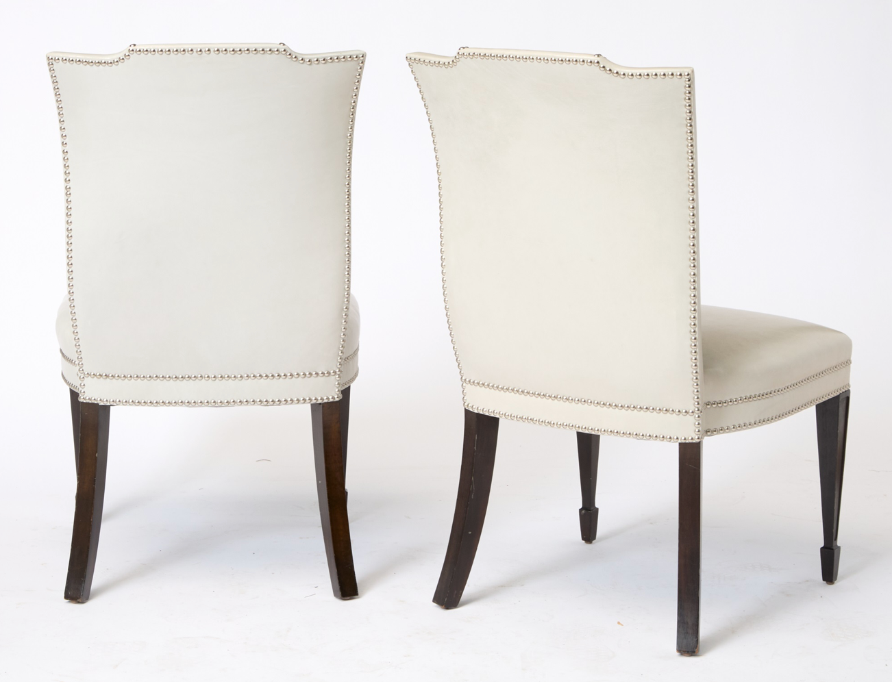 A Set of 12 Leather and Close Chrome Nailed Dining Chairs