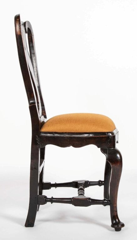 A set of 10 Queen Anne Black Painted Dining Chairs