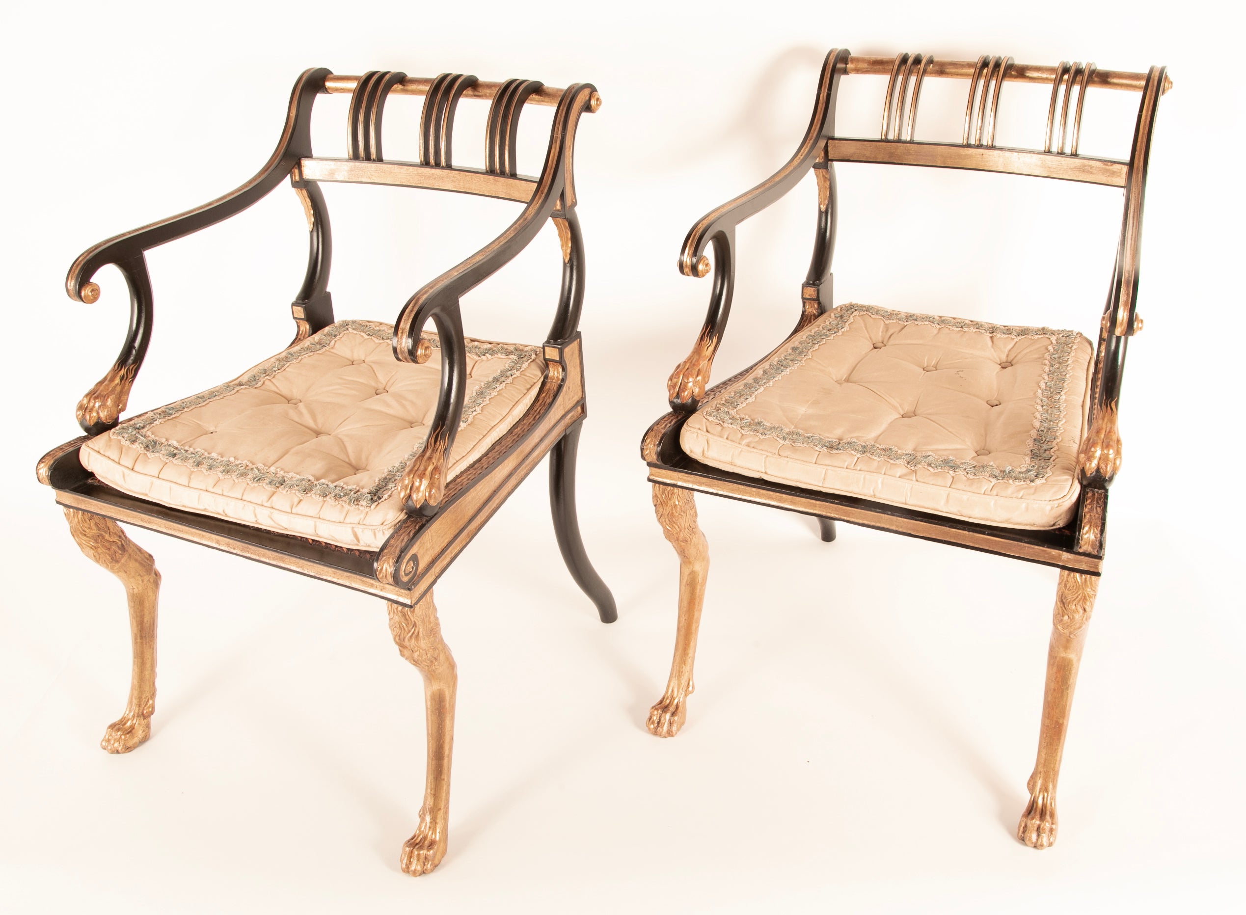 A Pair of Regency Style Ebonized and Parcel Gilt Armchairs