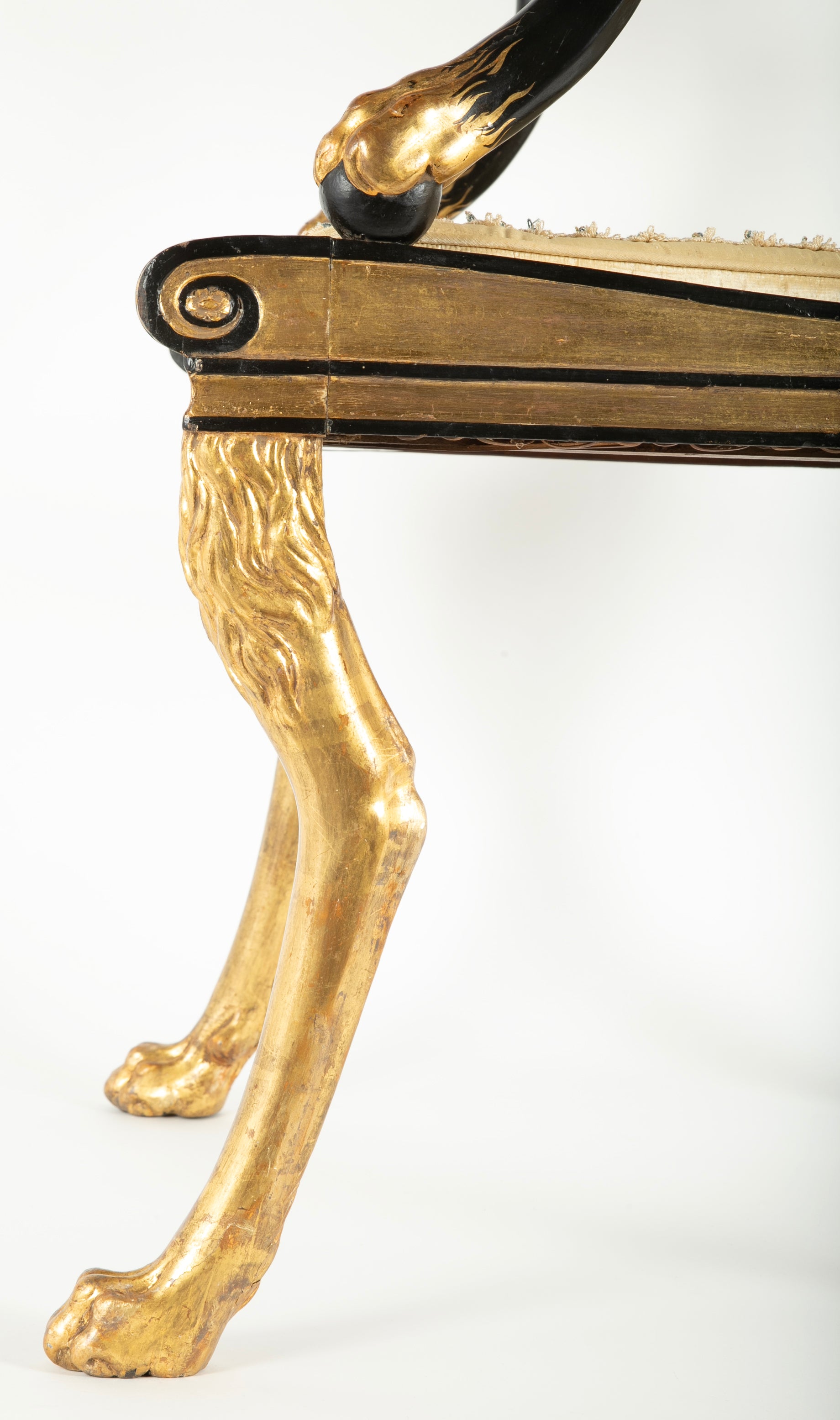 A Pair of Regency Style Ebonized and Parcel Gilt Armchairs