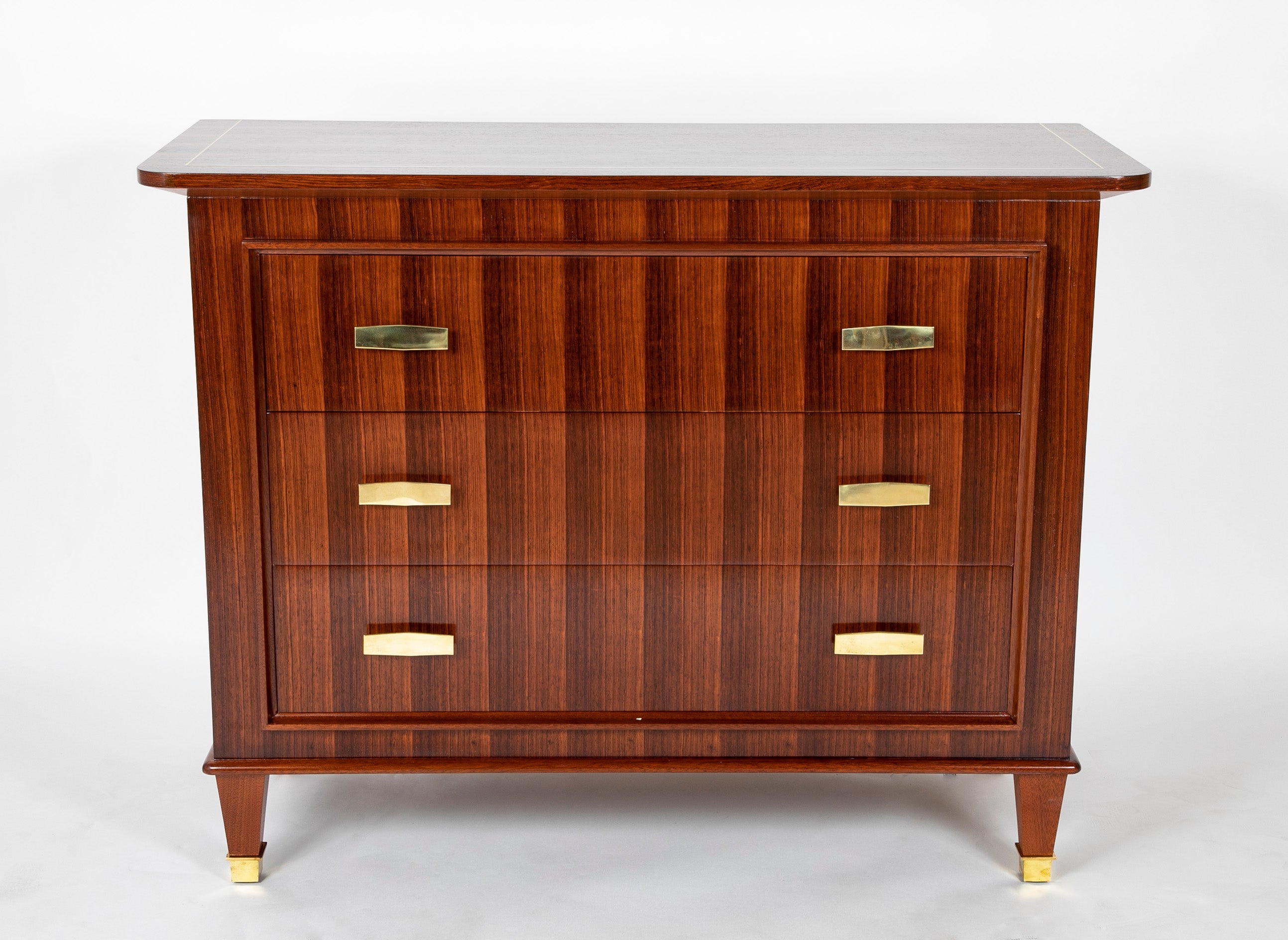 A Three Drawer Rosewood Commode in the Manner of Jacques Adnet