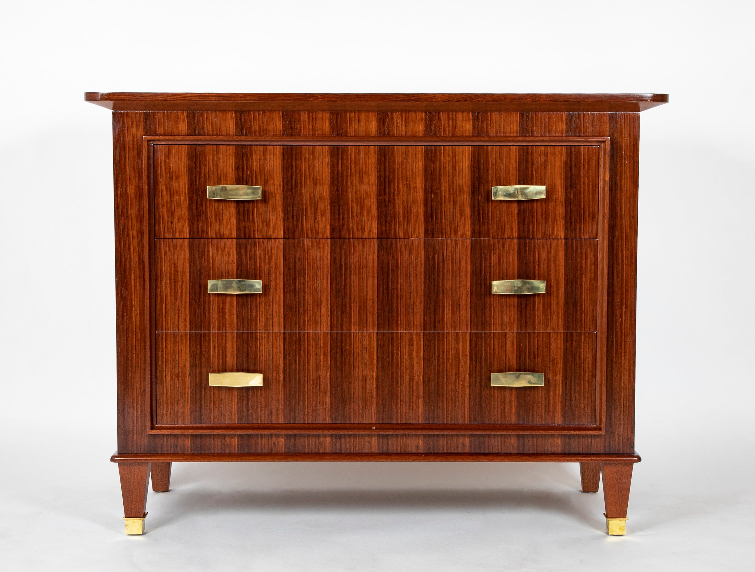 A Three Drawer Rosewood Commode in the Manner of Jacques Adnet