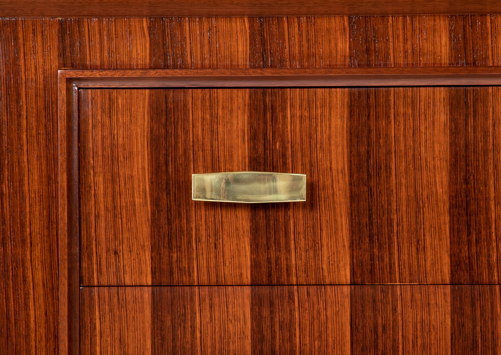A Three Drawer Rosewood Commode in the Manner of Jacques Adnet