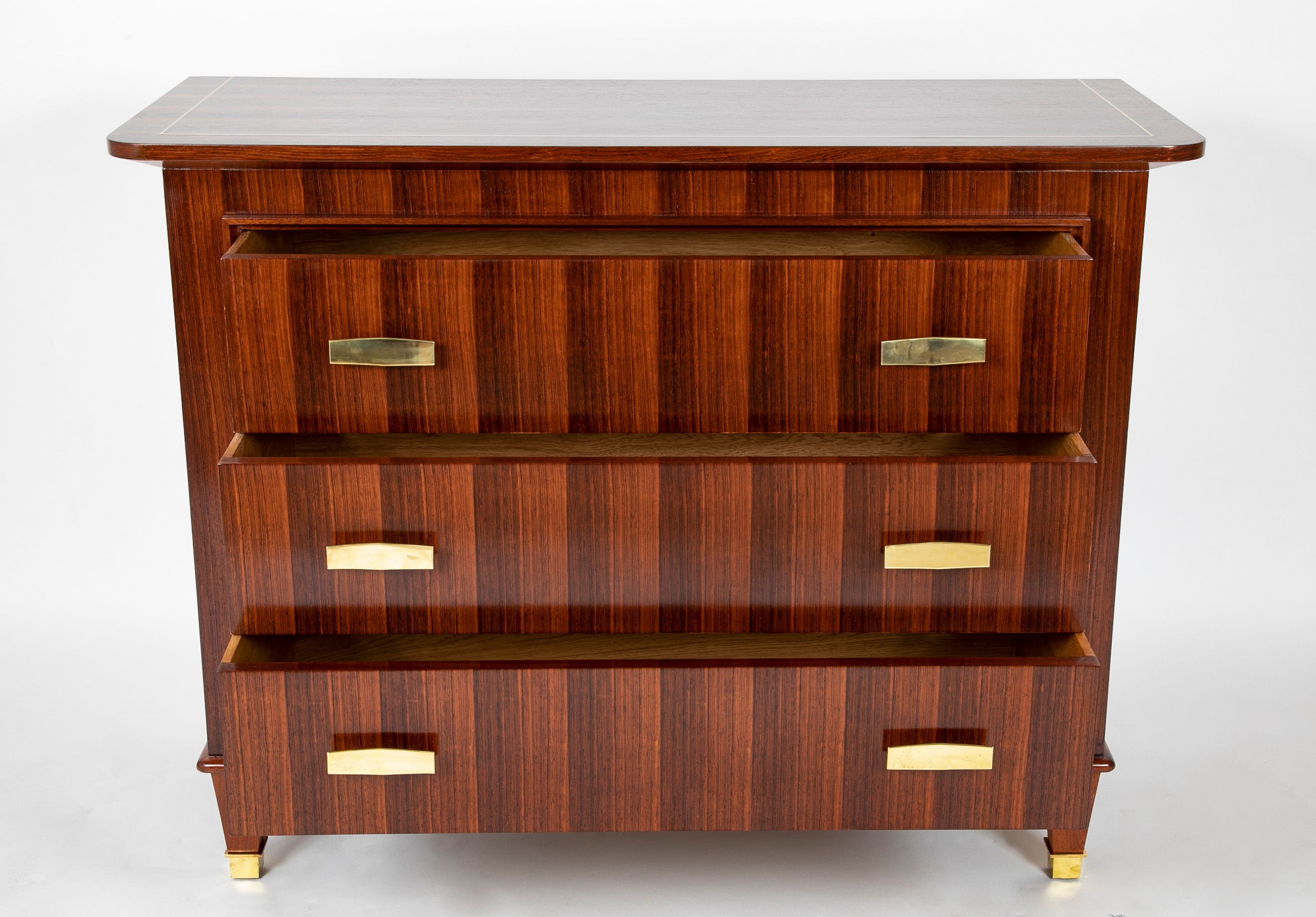 A Three Drawer Rosewood Commode in the Manner of Jacques Adnet
