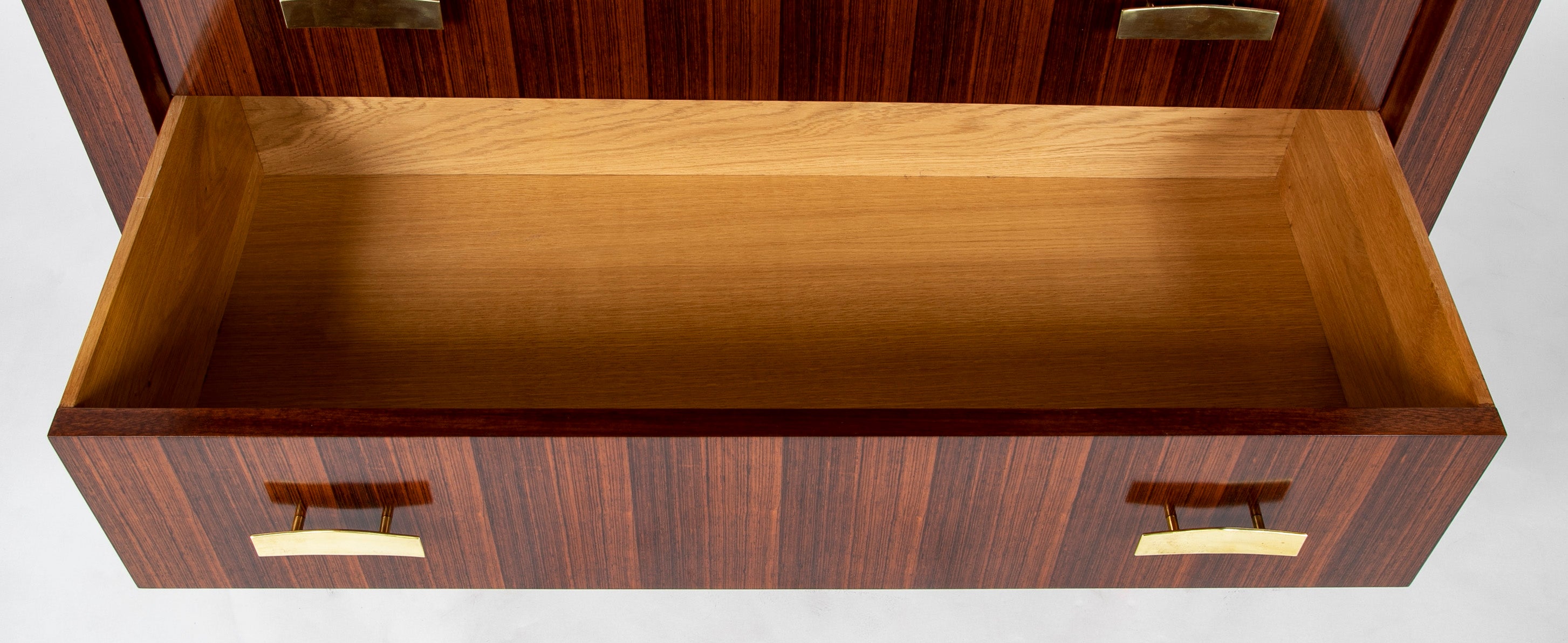 A Three Drawer Rosewood Commode in the Manner of Jacques Adnet