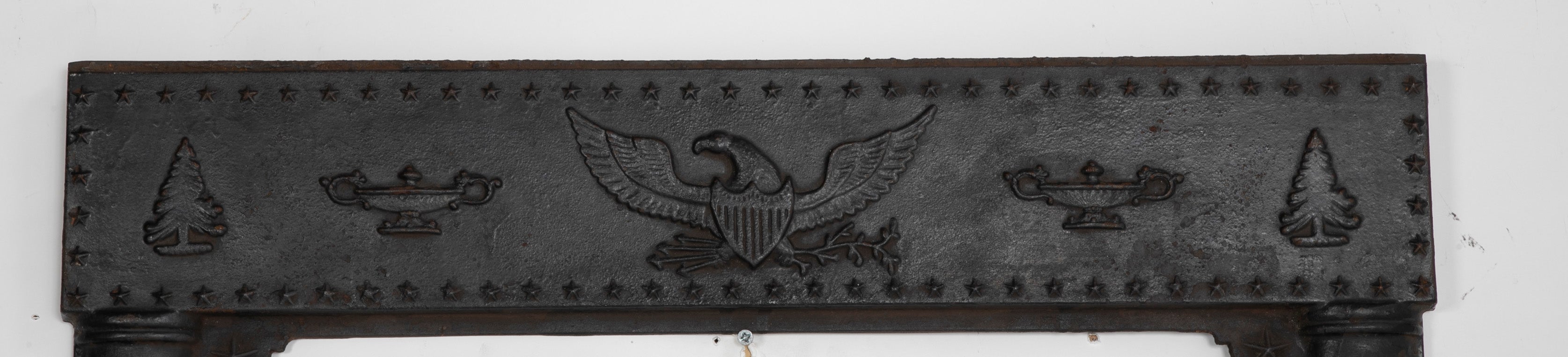 A Piece of an American Cast Iron Stove with Eagle, Wisdom Lamps & Evergreens