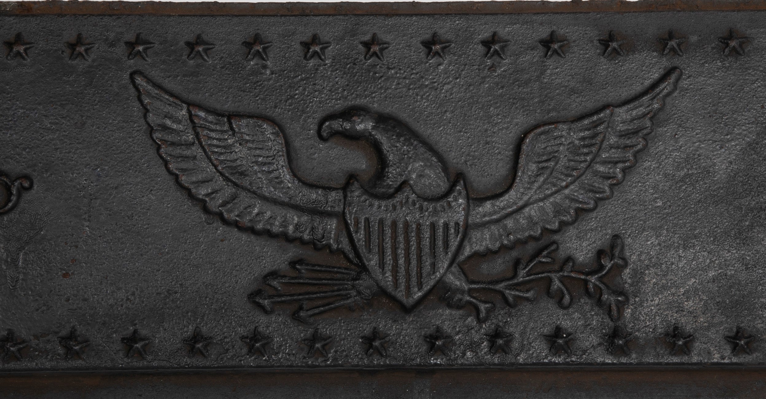 A Piece of an American Cast Iron Stove with Eagle, Wisdom Lamps & Evergreens