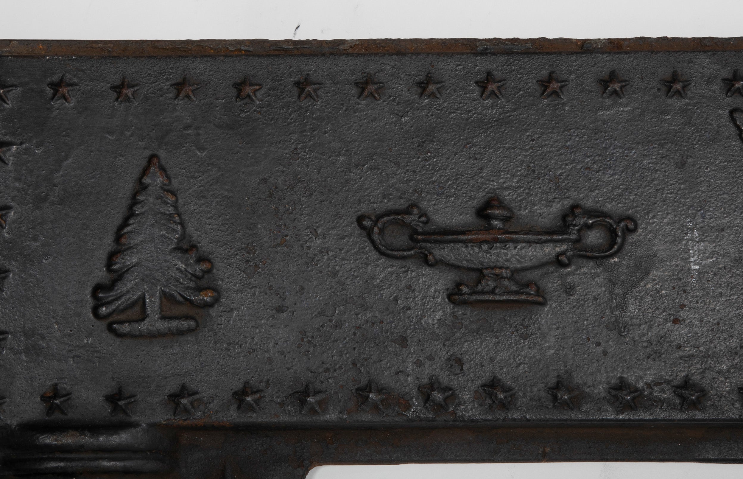 A Piece of an American Cast Iron Stove with Eagle, Wisdom Lamps & Evergreens