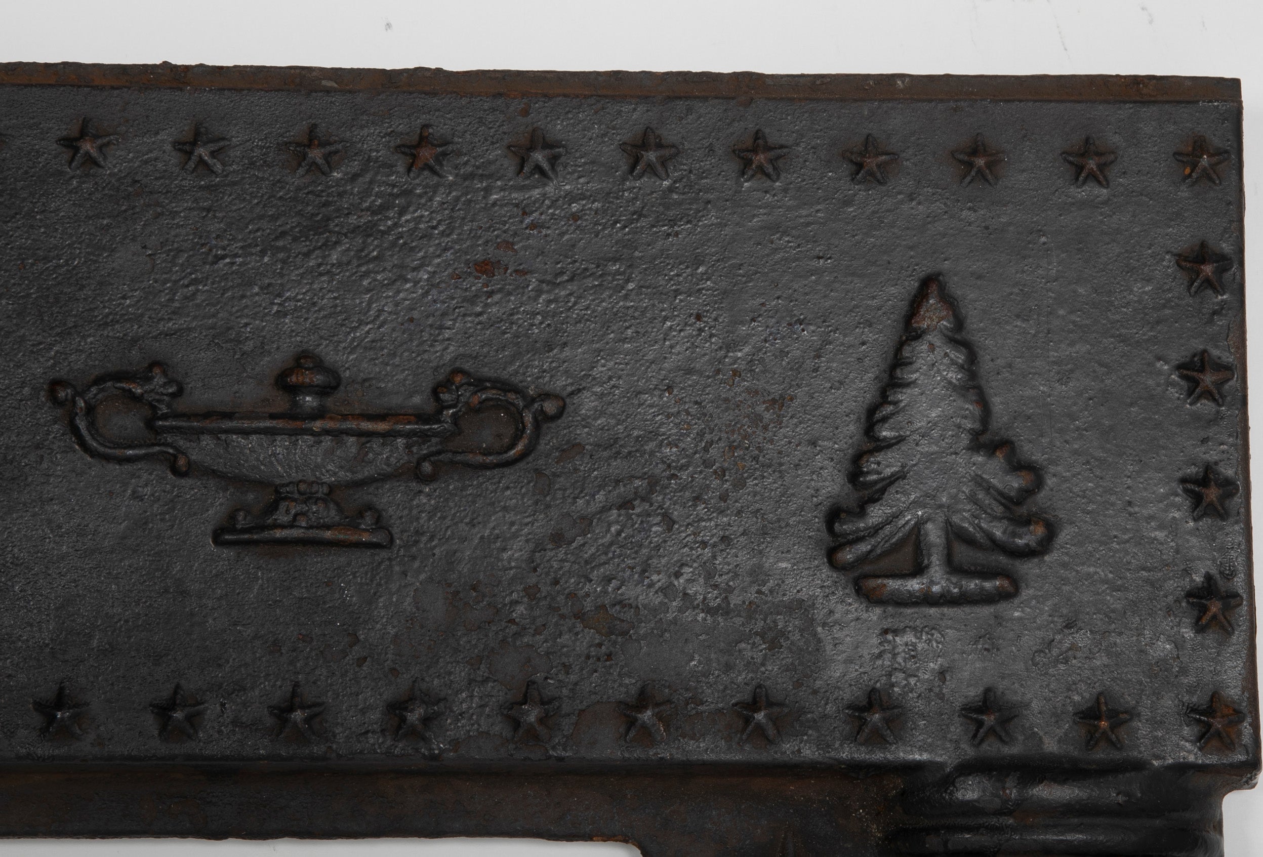 A Piece of an American Cast Iron Stove with Eagle, Wisdom Lamps & Evergreens