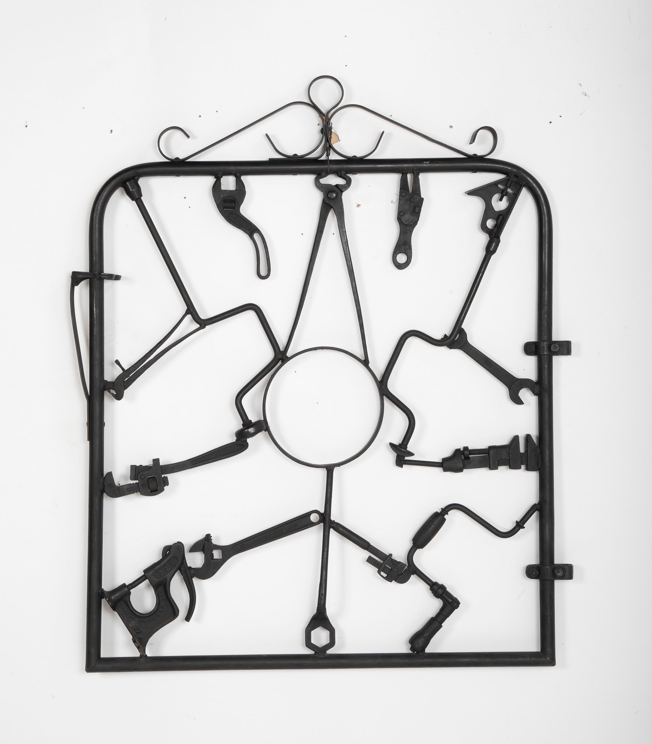 A Garden Gate in Wrought Iron with Antique Farm Tools by Rodney Rosebrook