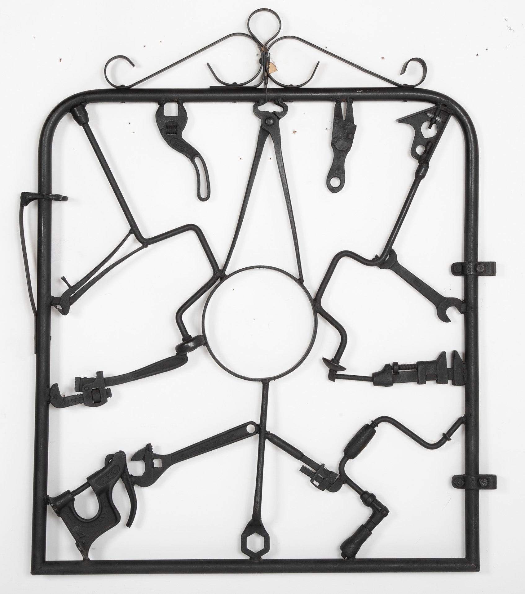 A Garden Gate in Wrought Iron with Antique Farm Tools by Rodney Rosebrook