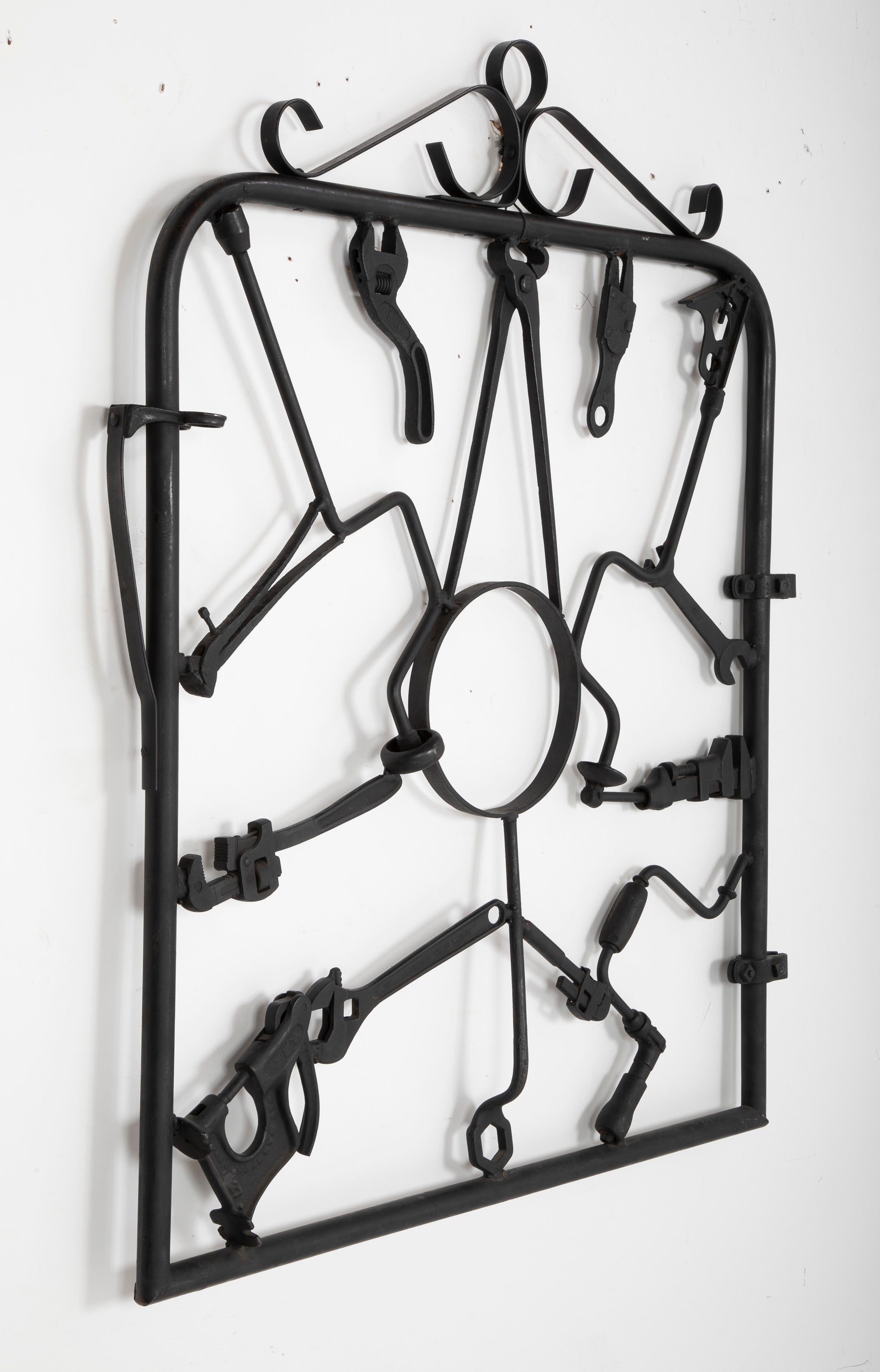 A Garden Gate in Wrought Iron with Antique Farm Tools by Rodney Rosebrook