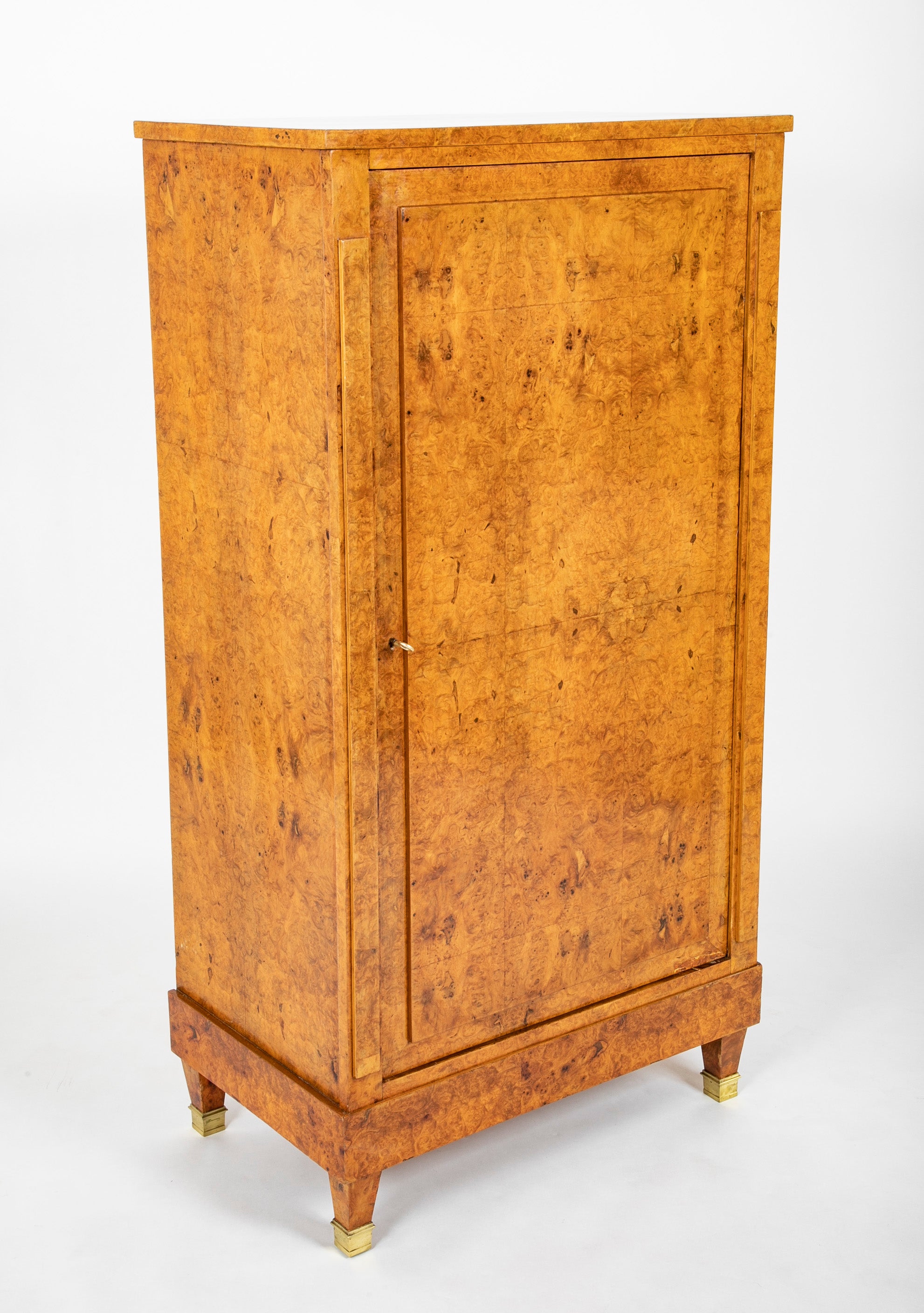 A French Burlwood Cabinet on Bronze Sabots