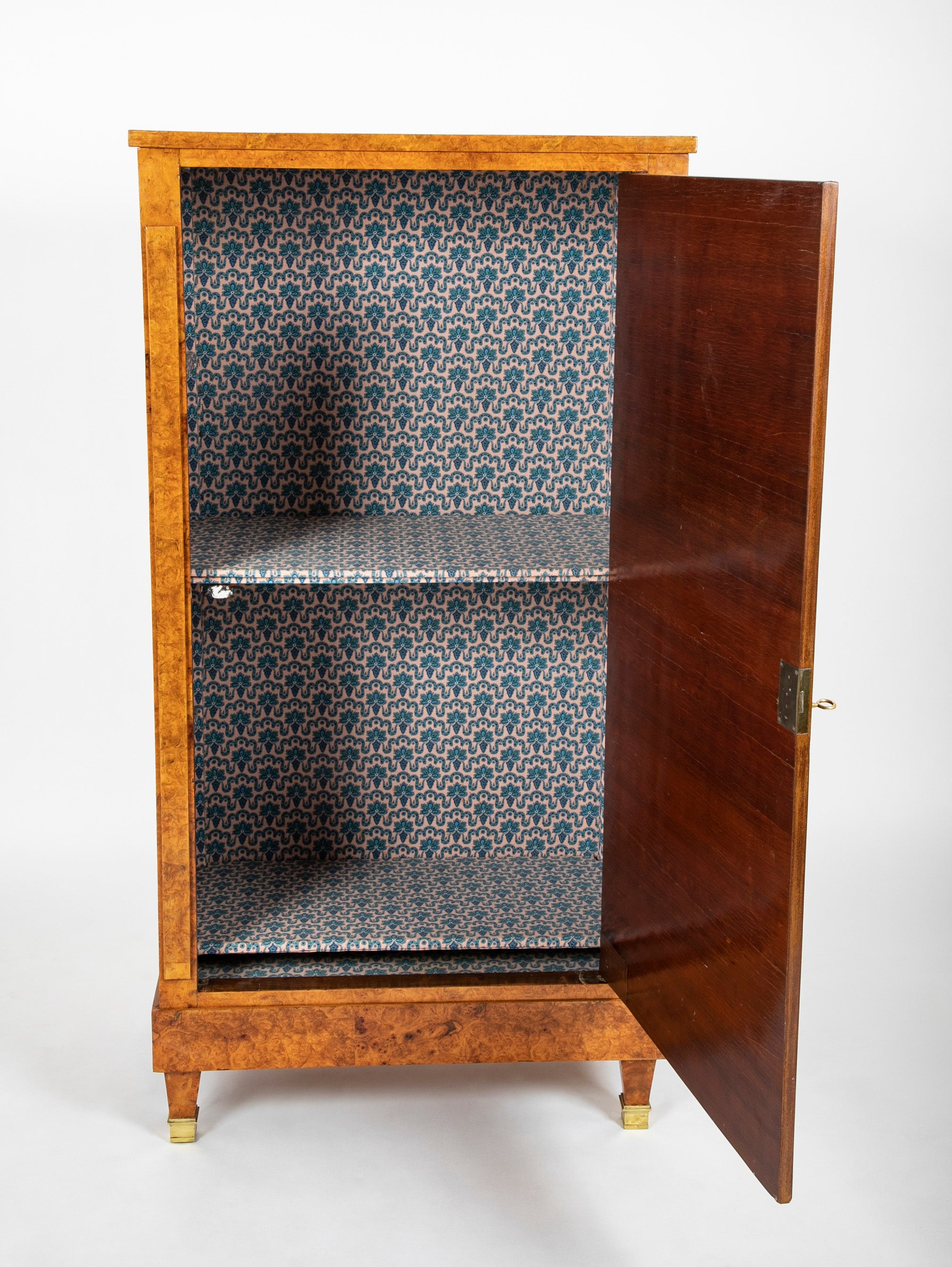 A French Burlwood Cabinet on Bronze Sabots