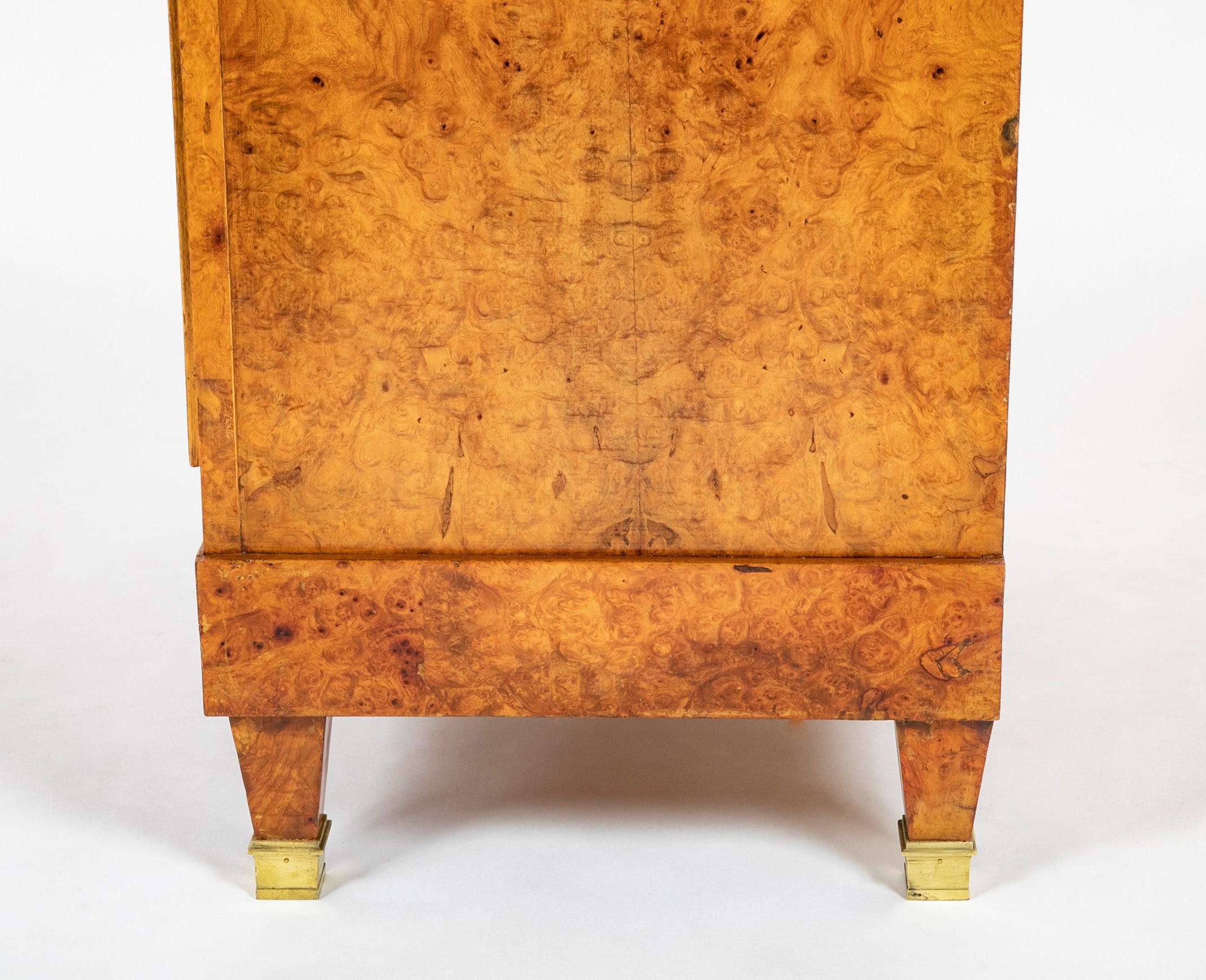 A French Burlwood Cabinet on Bronze Sabots