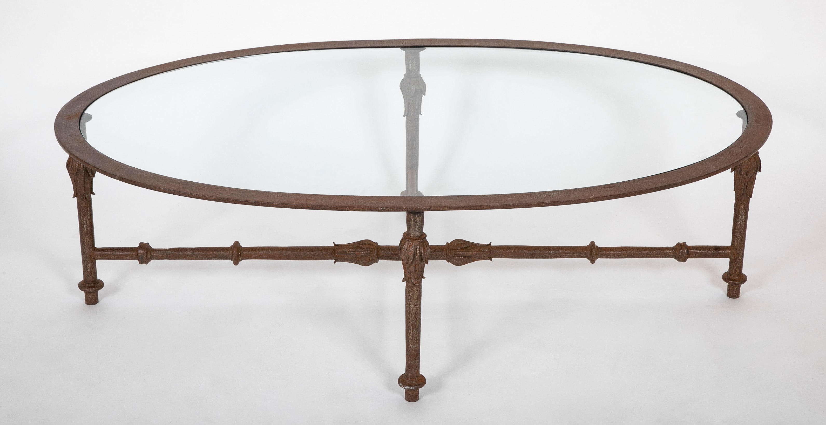 A Mid-Century Iron and Glass Oval Coffee Table