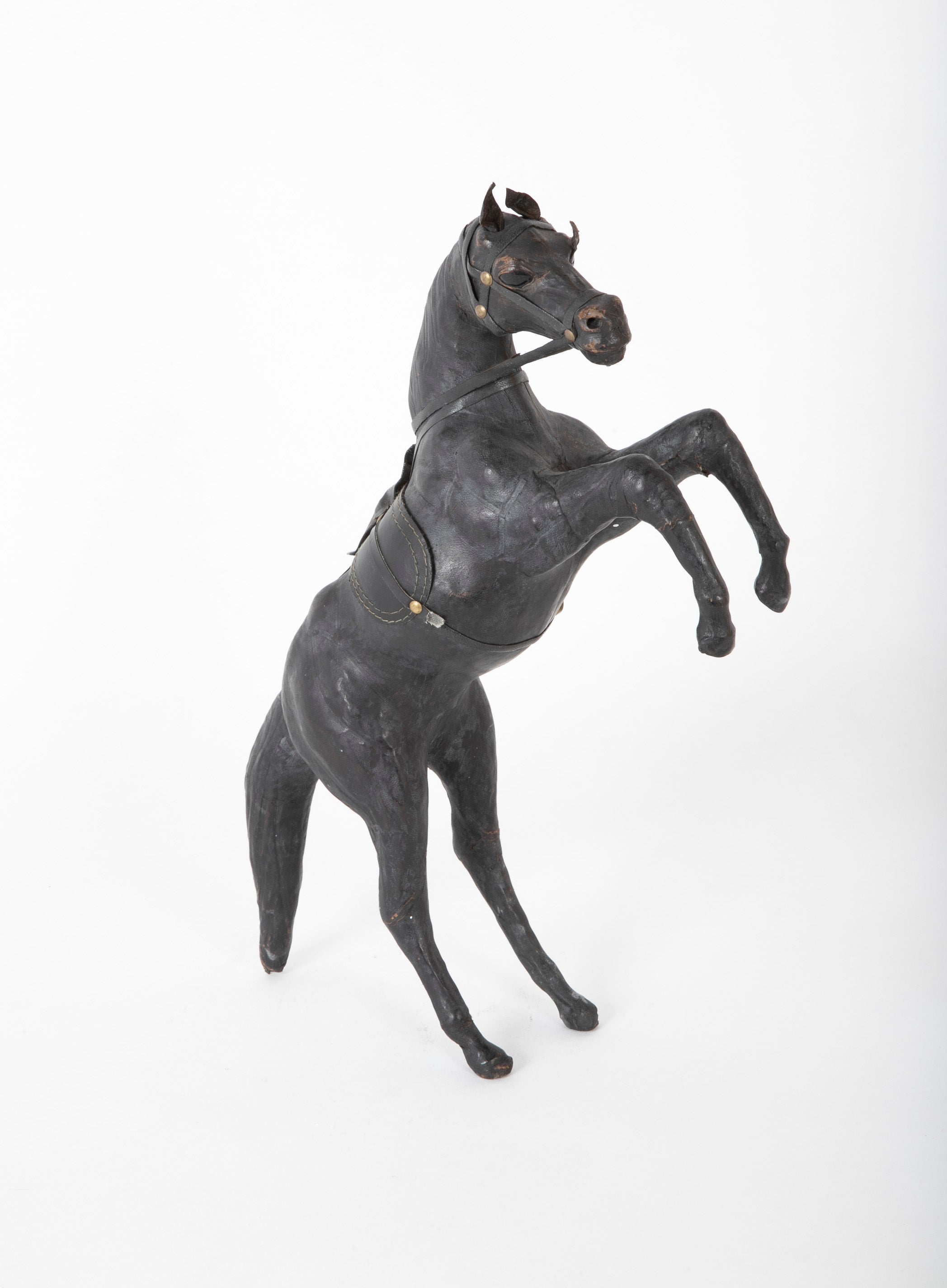 An Argentine Leather Clad Wood Horse