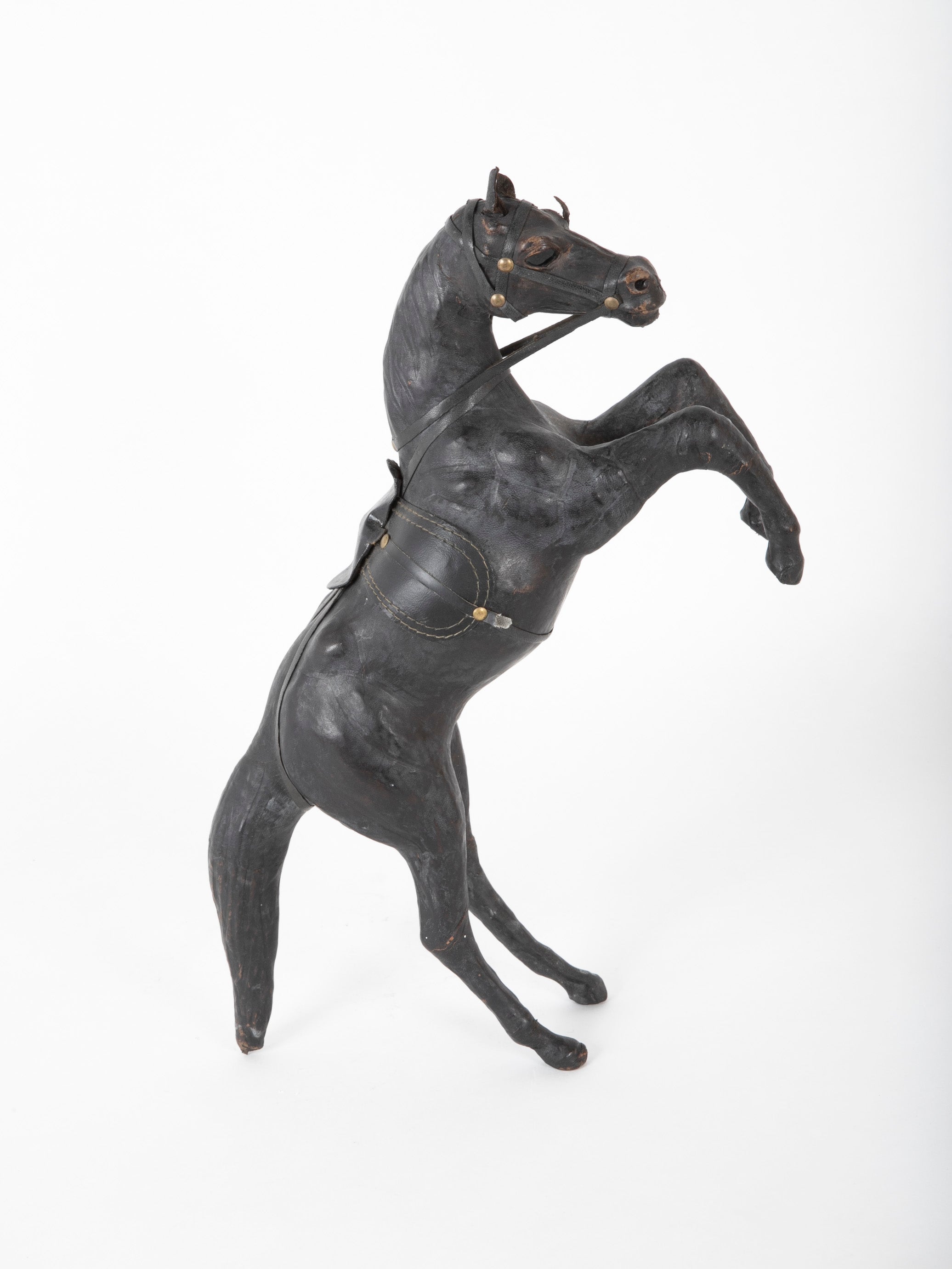 An Argentine Leather Clad Wood Horse
