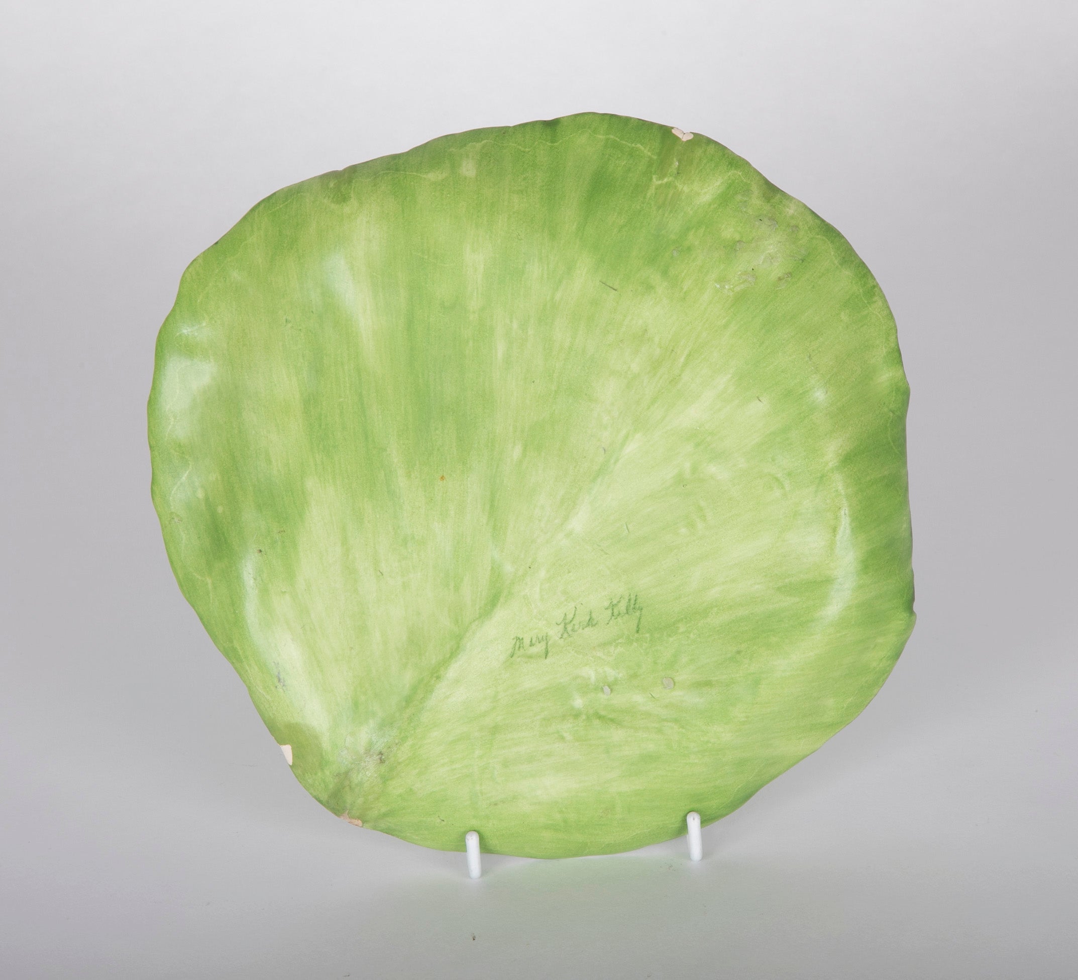 A Pair of Mary Kirk Kelly Porcelain Plates in Leaf Form