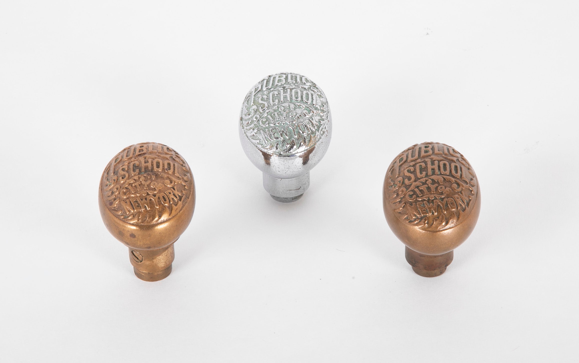 Set of Three New York City Public School Brass Door Knobs