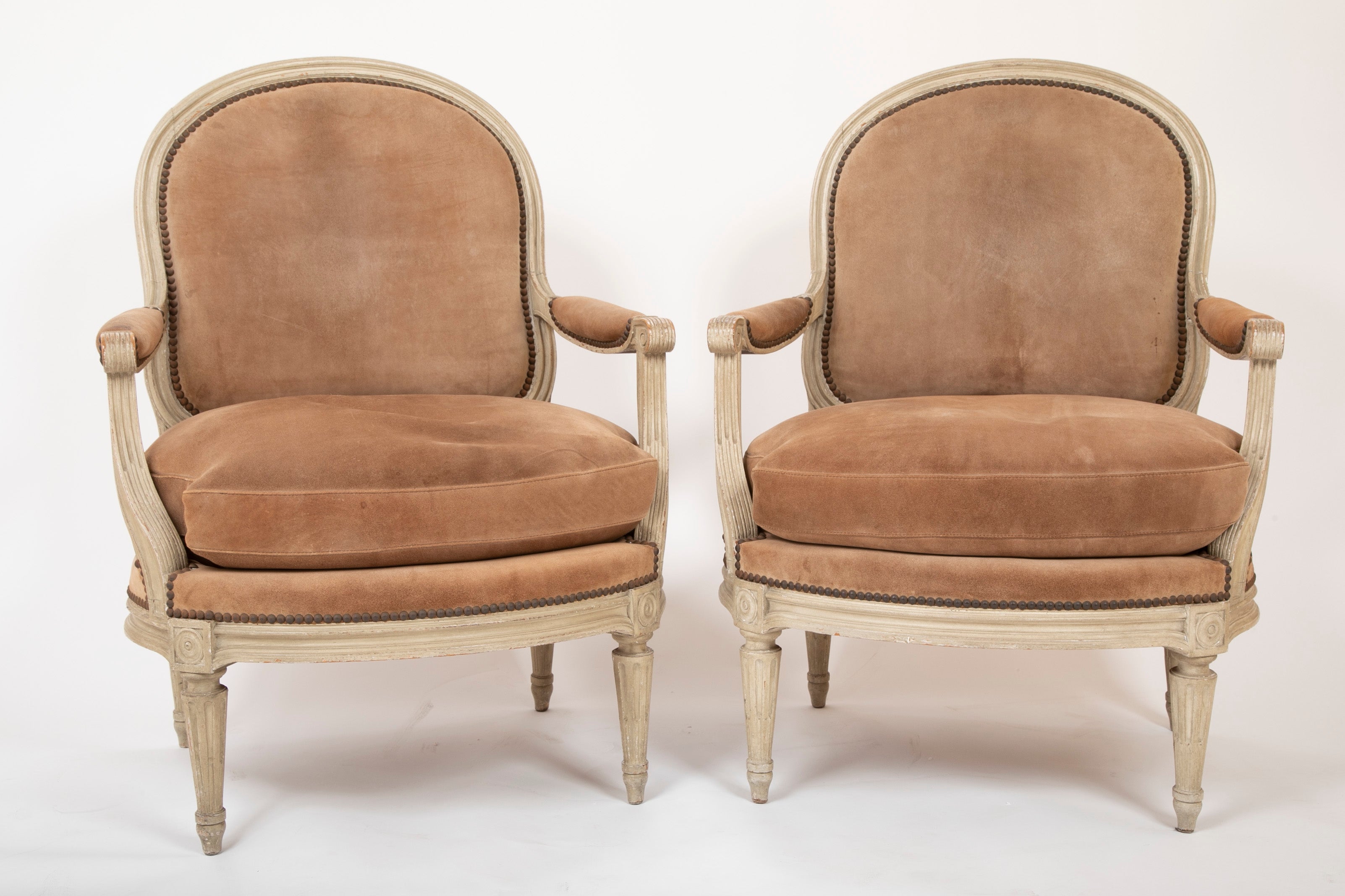 A Pair of Louis XVI Style Suede and Painted Armchairs by Maison Jansen