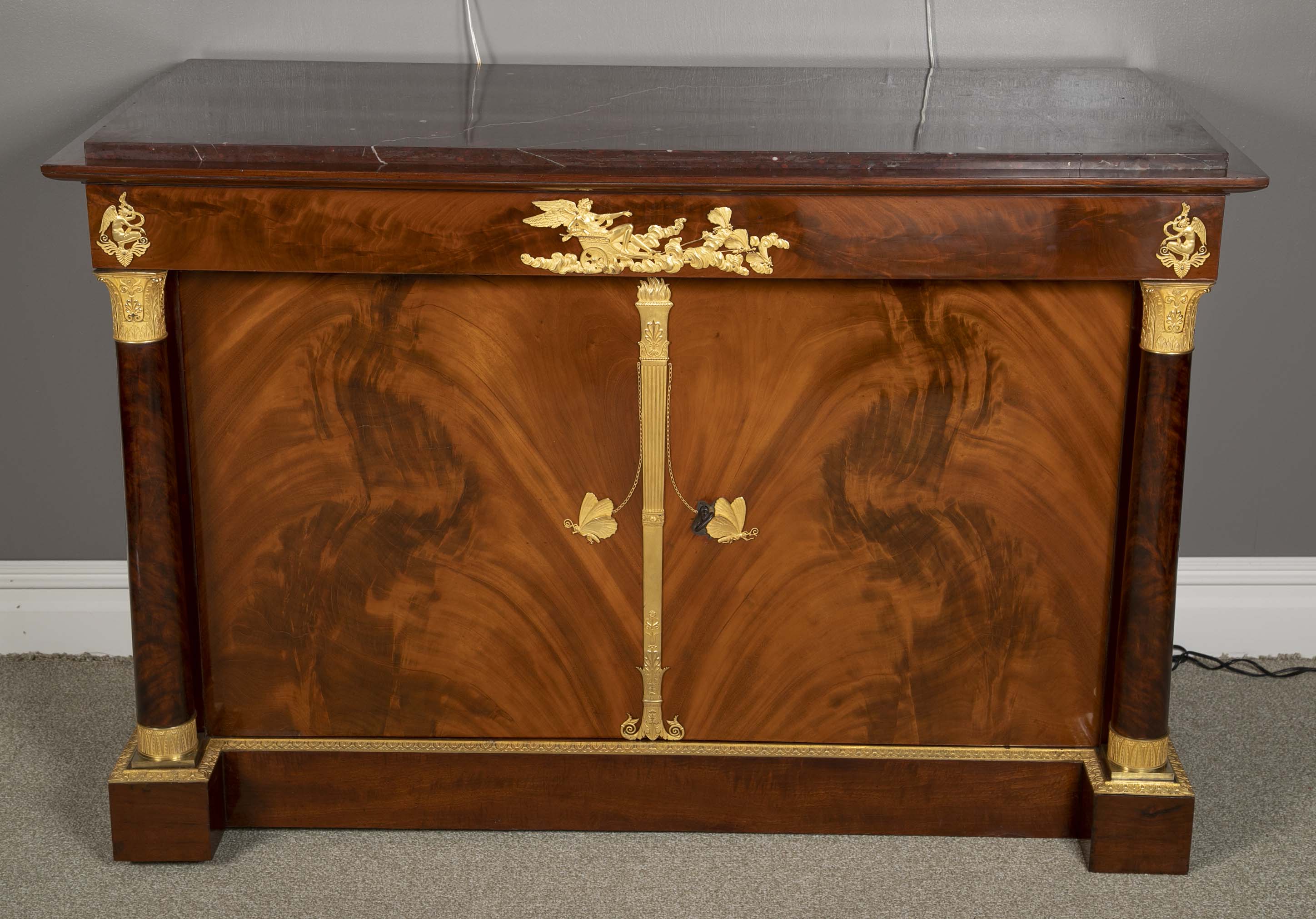 A Molitor French Empire Flame Mahogany and Gilt Bronze Commode with Rouge Griotte