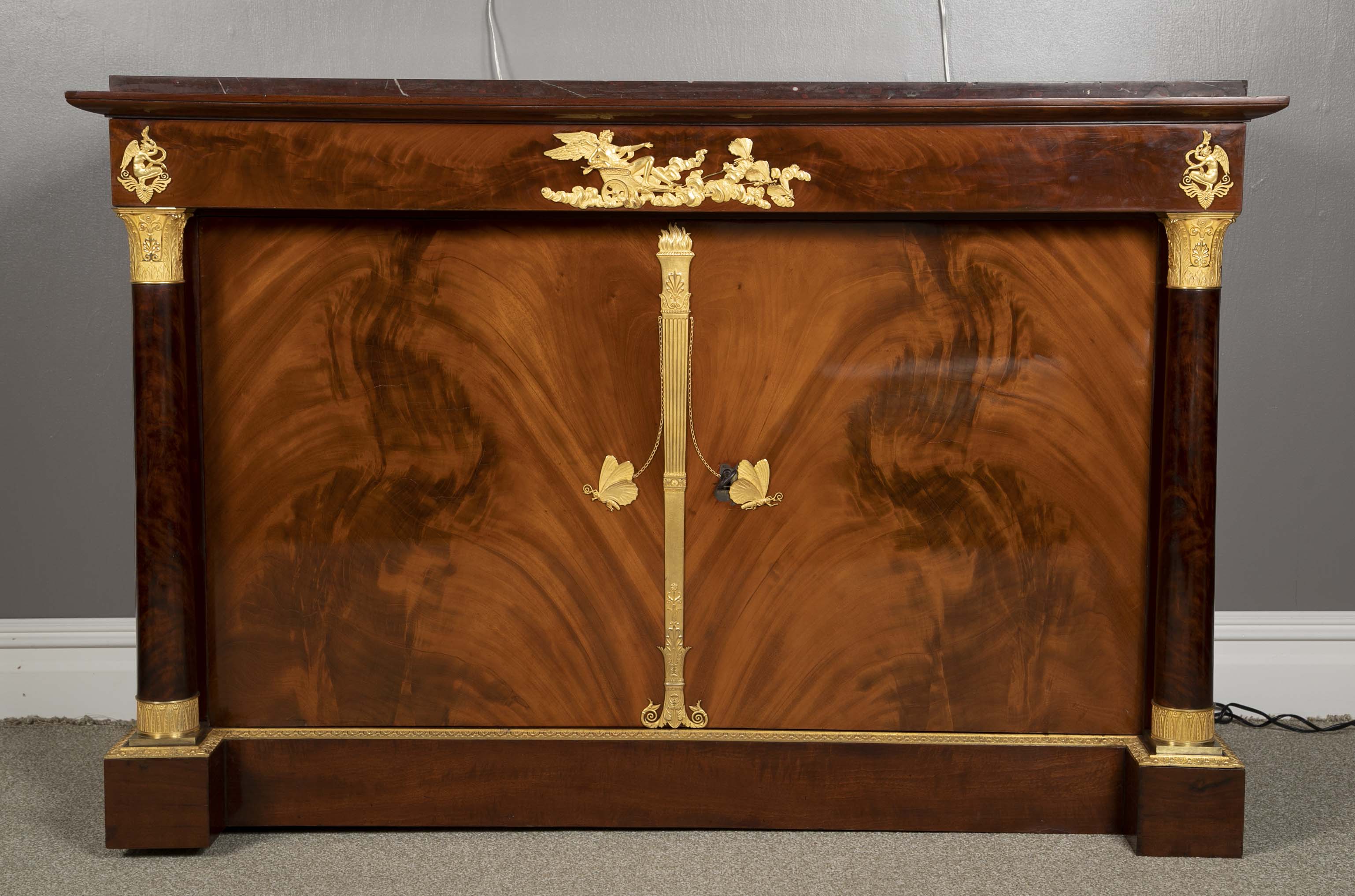 A Molitor French Empire Flame Mahogany and Gilt Bronze Commode with Rouge Griotte
