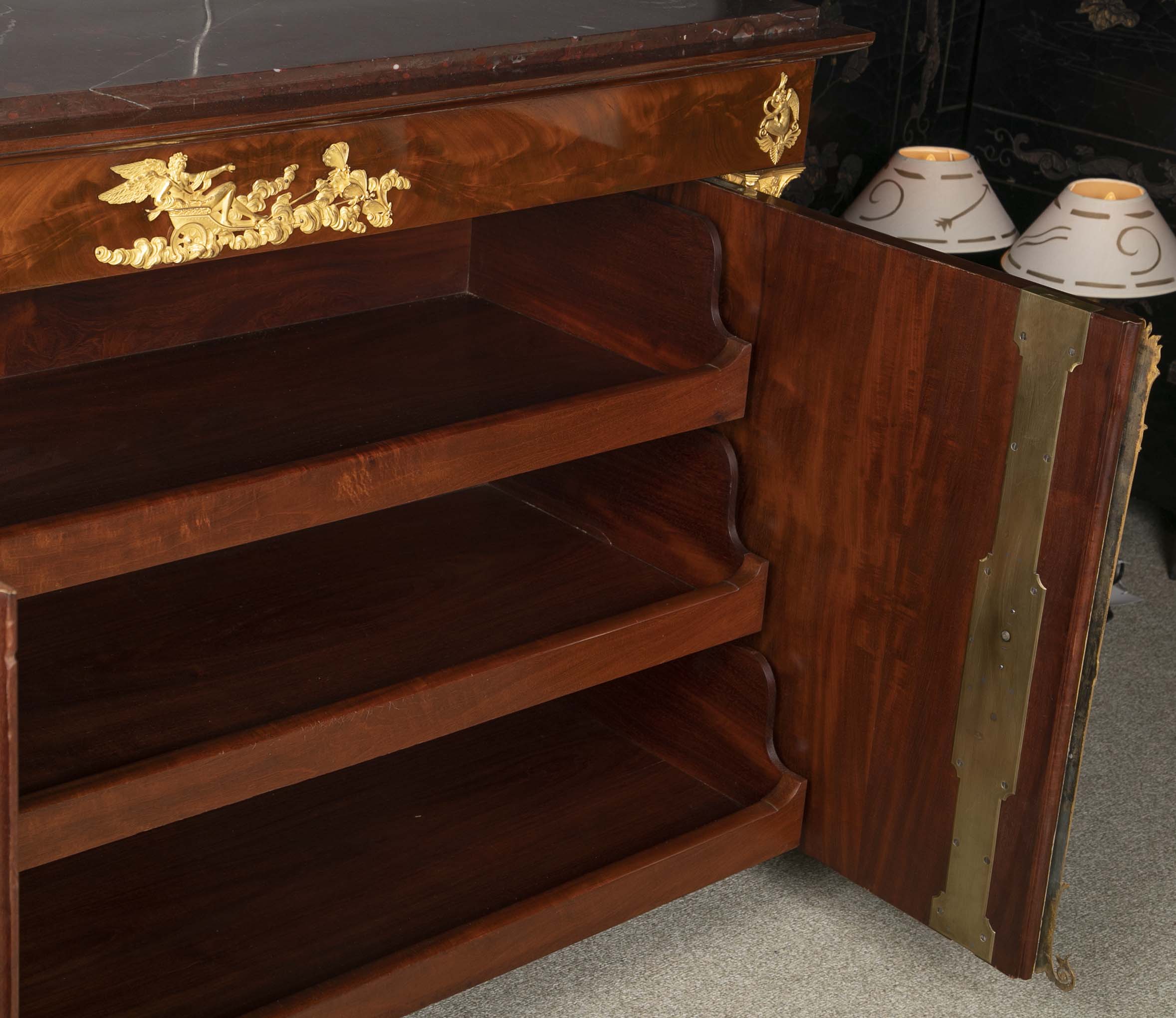 A Molitor French Empire Flame Mahogany and Gilt Bronze Commode with Rouge Griotte