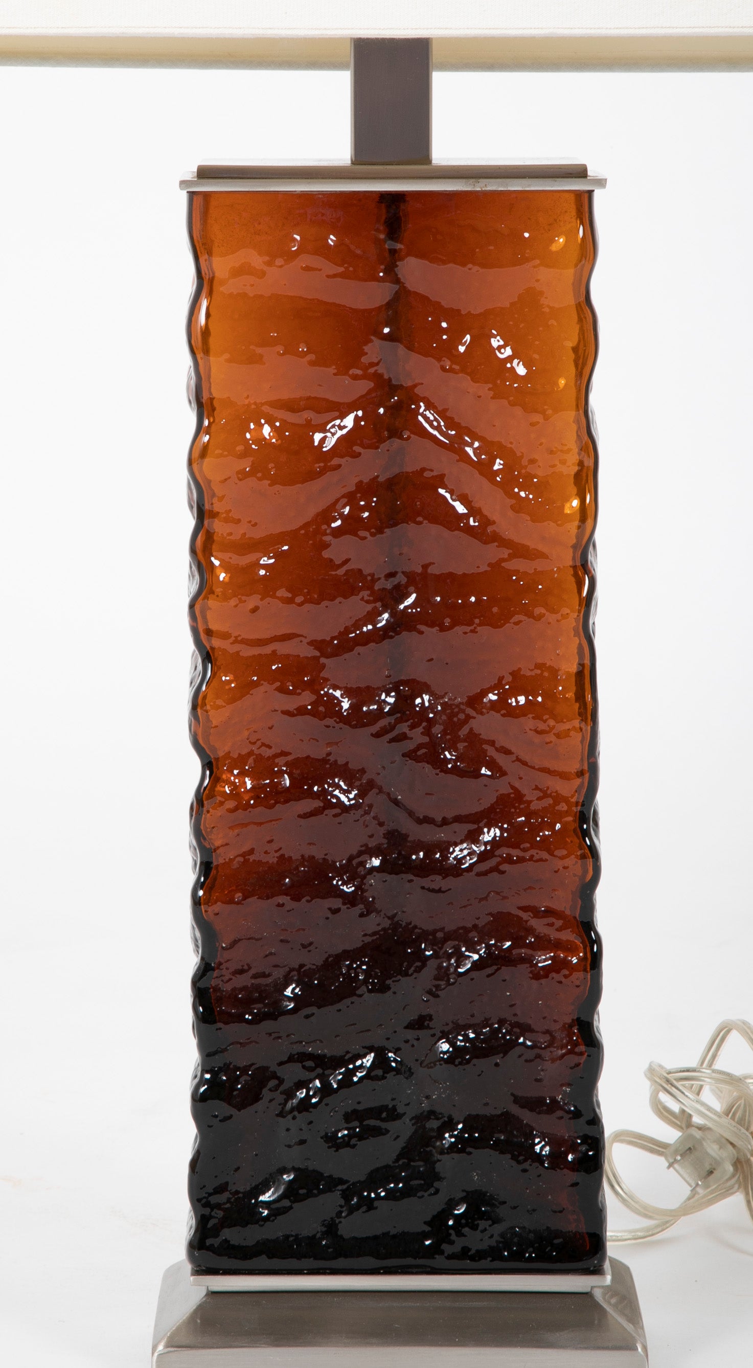 A Pair of Mid-Century Wavy Amber Glass & Steel Lamps