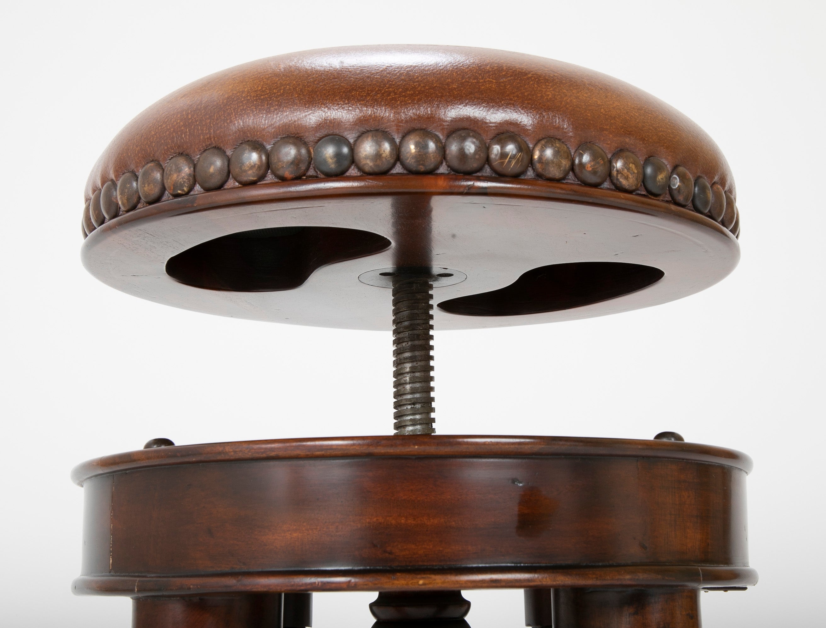 Bronze Four Legged Adjustable Revolving Stool with Leather Upholstered Seat