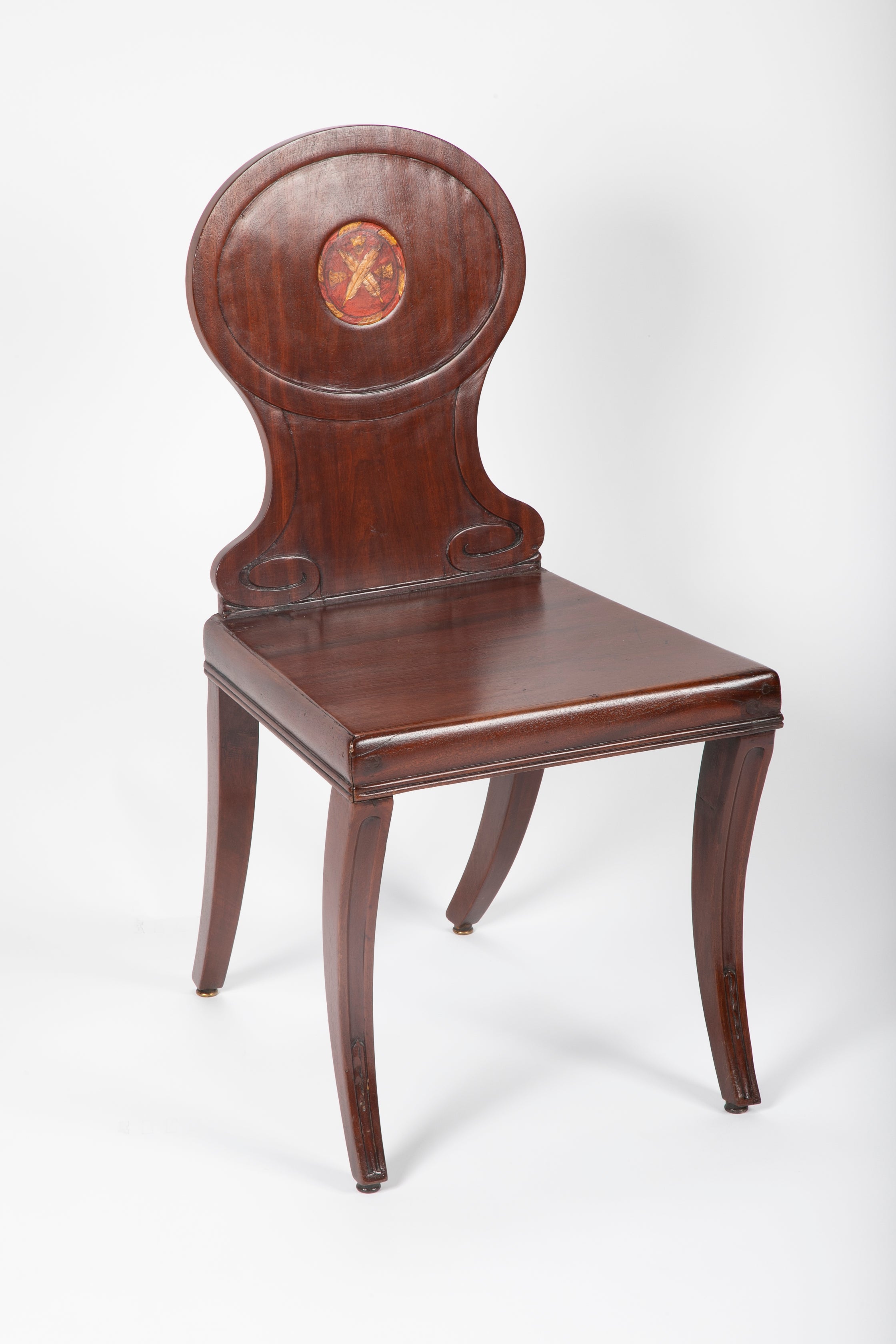 A Pair of Late Georgian Mahogany and Polychrome Hall Chairs