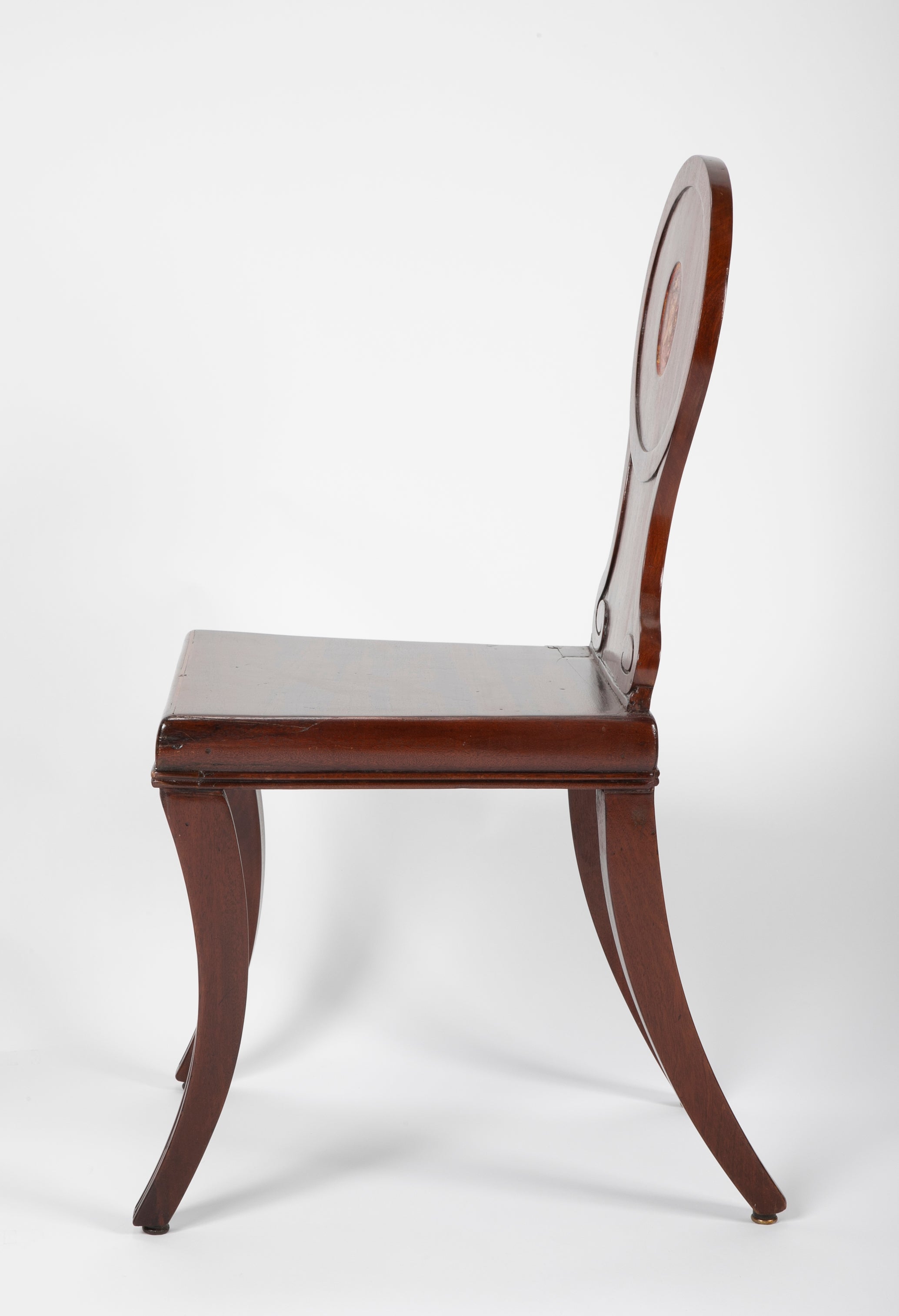 A Pair of Late Georgian Mahogany and Polychrome Hall Chairs