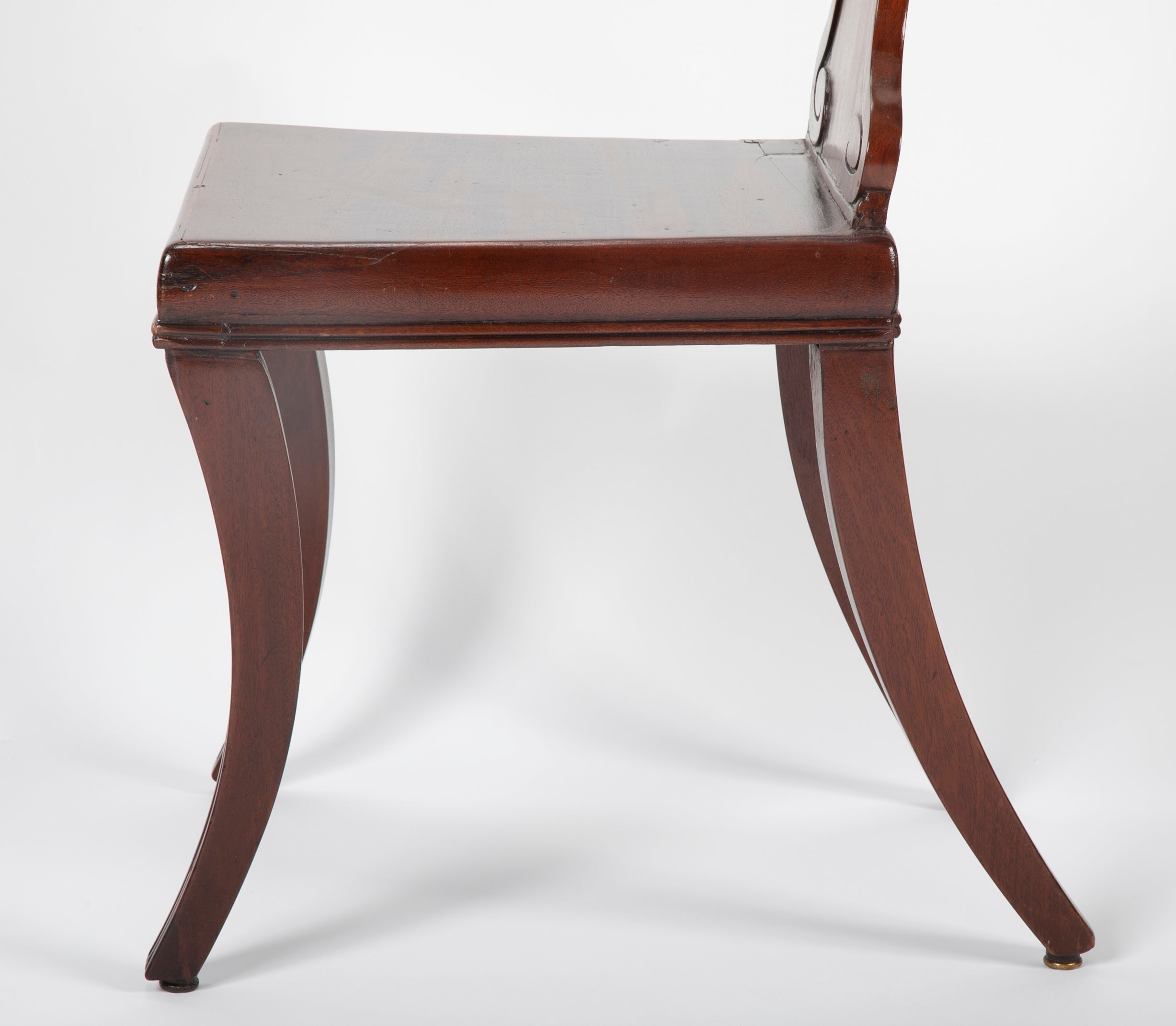 A Pair of Late Georgian Mahogany and Polychrome Hall Chairs